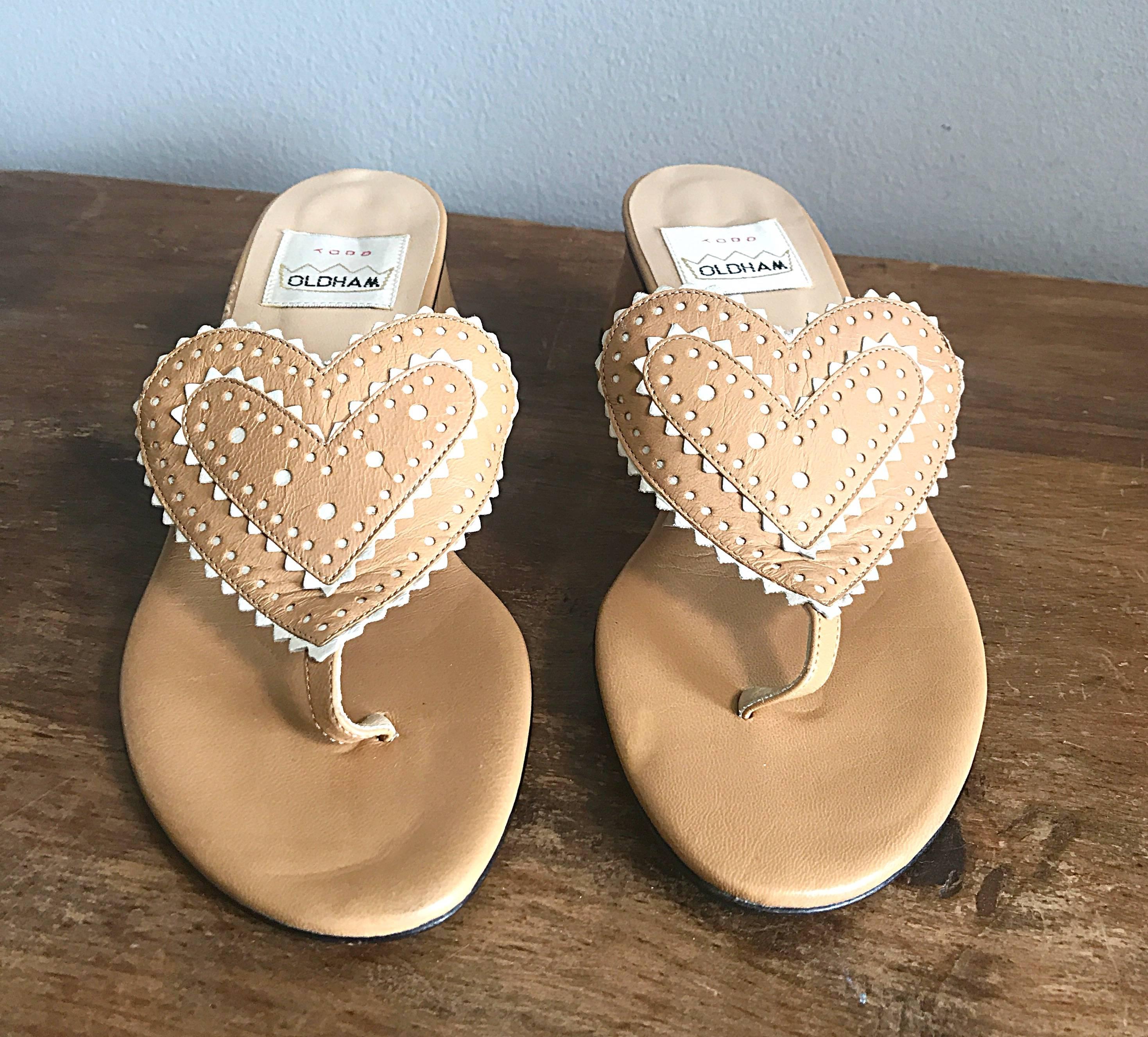 Collectible and brand new vintage 90s TODD OLDHAM Avant Garde tan and ivory mid block heel leather thong sandals! Features a heart shaped toe / foot strap with perforated tan and ivory leather. Avant Garde angled block heel. Super comfortable, and
