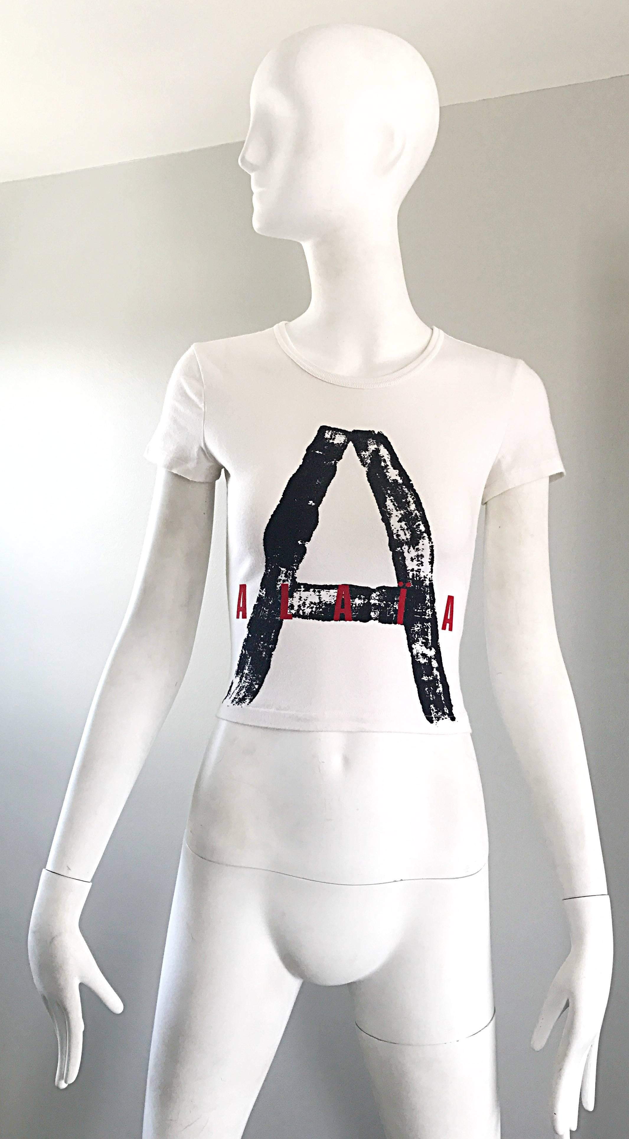 Rare and simply amazing vintage 90s ALAIA X COMME DES GARCONS black, white and red logo crop top! I have searched and searched for a piece from this collection for AGES! Truly a piece of fashion history, this rare gem features a black graffiti print