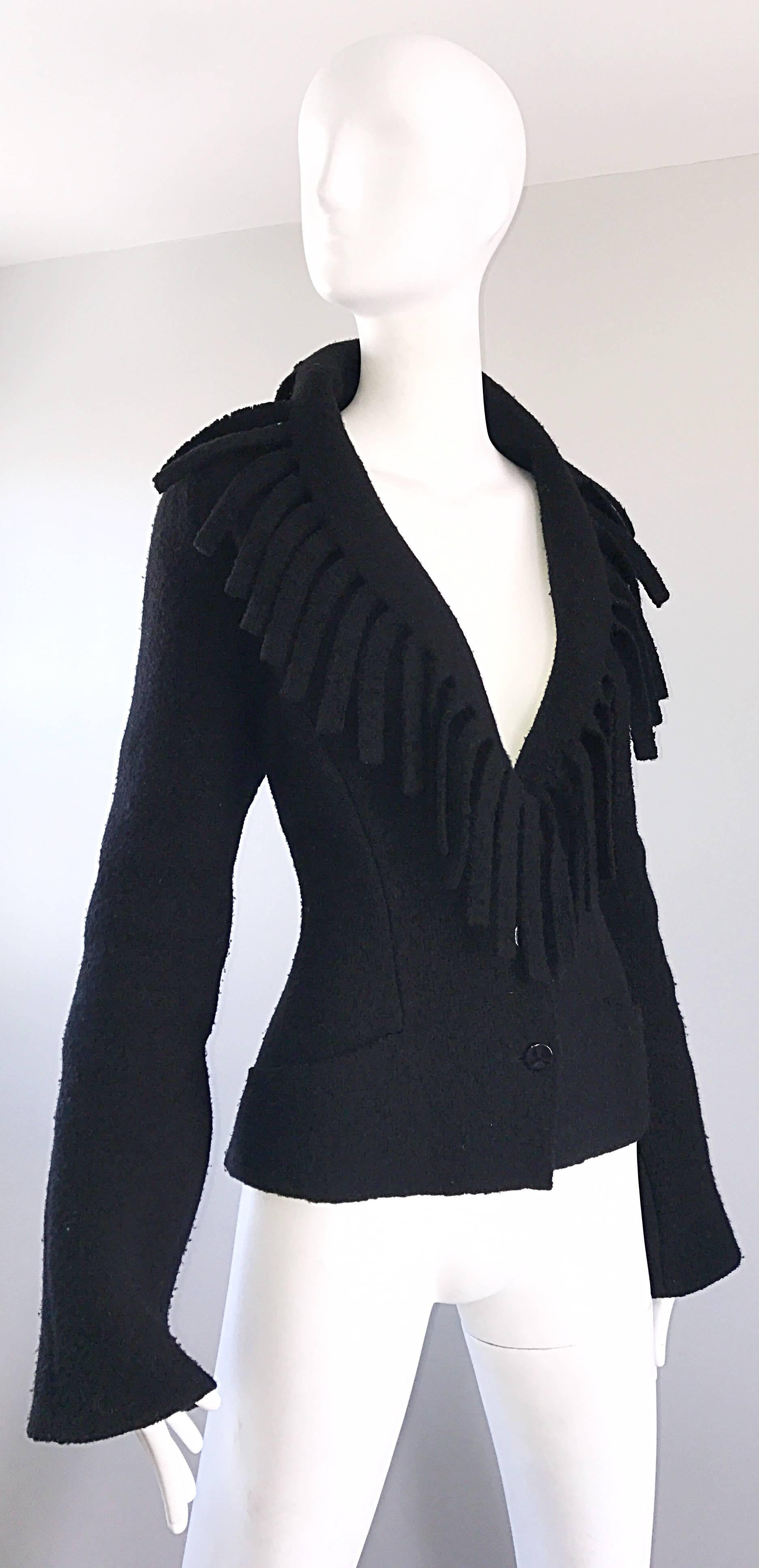 Rare vintage THIERRY MUGLER Avant Garde boiled wool knit blazer jacket! Features amazing fringe around the entire collar that hangs loosely. Buttons up the front bodice. Functional pocket at each side of the waist. Super soft comfortable boiled wool