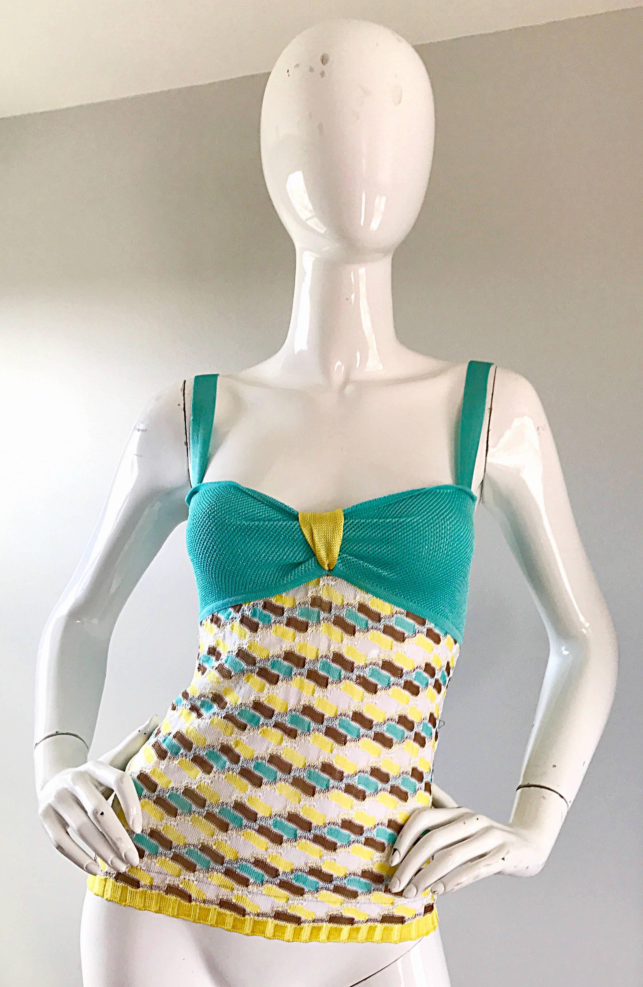 Chic vintage late 1990s MISSONI knit rayon sleeveless crochet tank top! Features signature mosaic prints in vibrant teal blue, yellow, brown and white. Turquoise bodice, with a neon yellow 'knot' at center bust. Can easily be dress up or down. Great