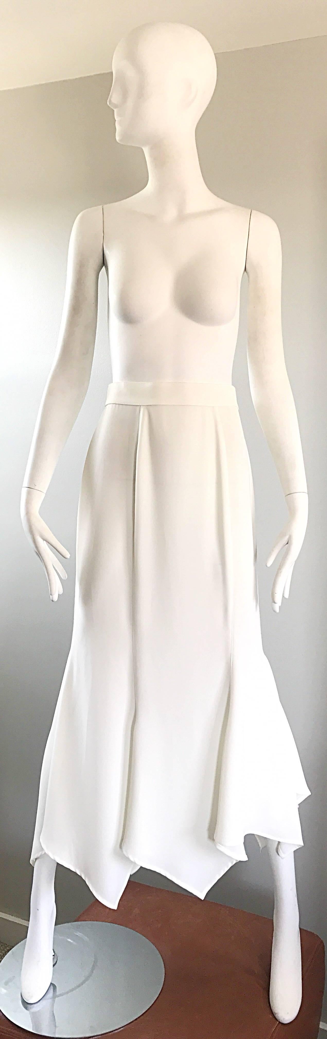 Striking vintage early 90s THIERRY MUGLER white handkerchief hem maxi skirt! Features an asymmetrical hem that looks fantastic with movement! Hidden zipper up the back with signature Mugler snaps at back center waistband. Can easily be dressed up or