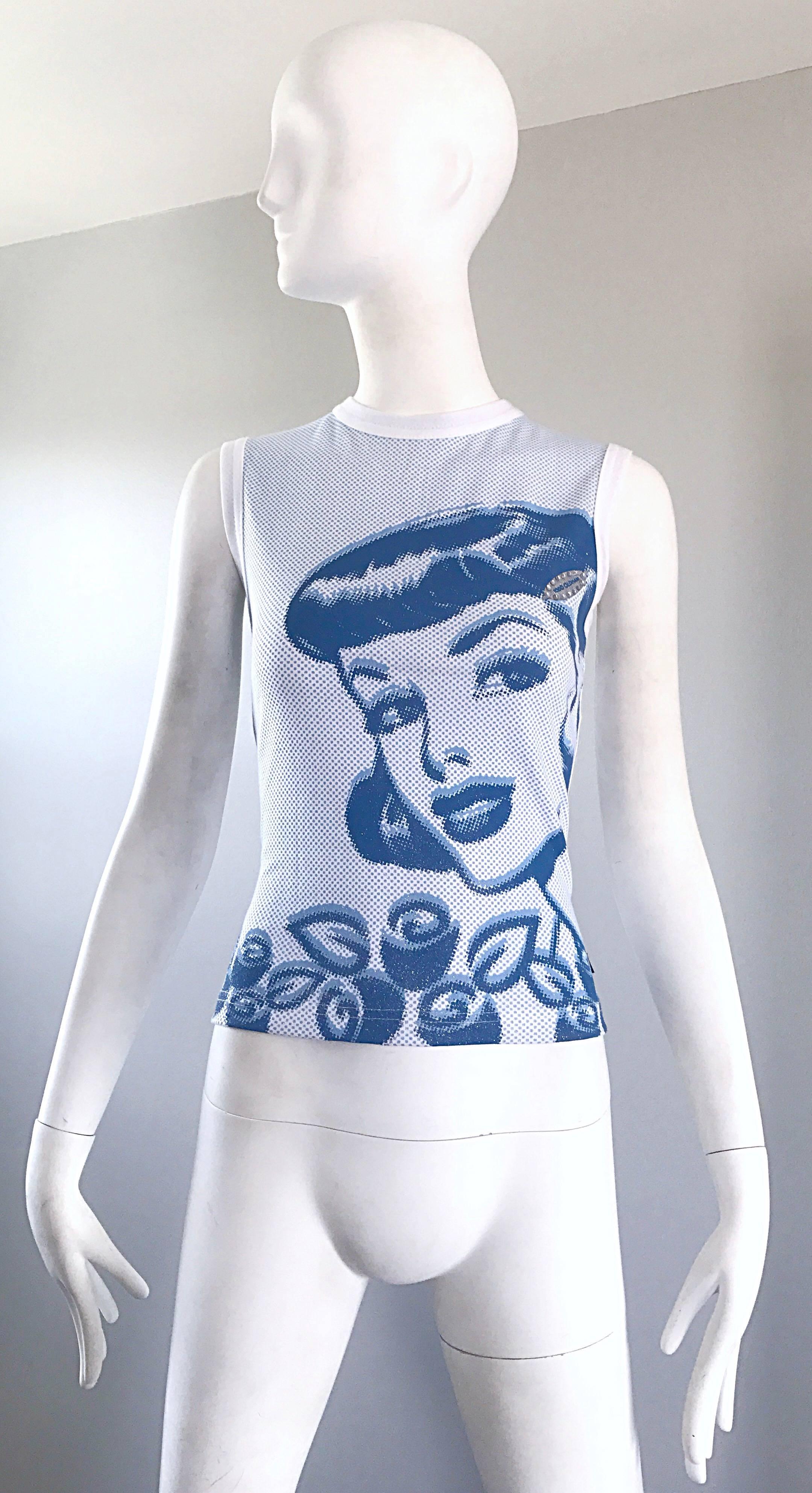 Rare and amazing 90s TODD OLDHAM blue and white op-art sleeveless blouse! Features a hand painted cartoon character on the front with tiny dots throughout. Rhinestones surround the logo above the left breast. Great with jeans, shorts or a skirt. In