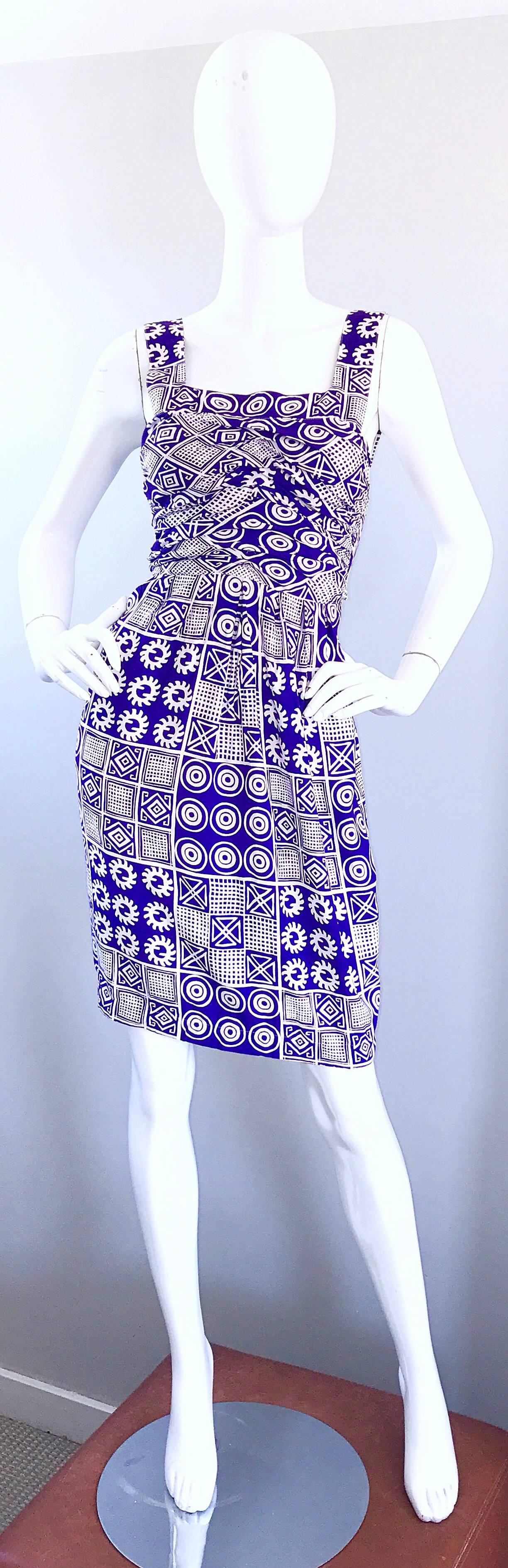 Sexy vintage CHRISTIAN LACROIX purple and white tribal print open back rayon dress! Features vibrant prints throughout. Flattering ruched bodice. Hidden zipper up the back skirt with hook-and-eye closure. Ties at the back, so can accomodate an array