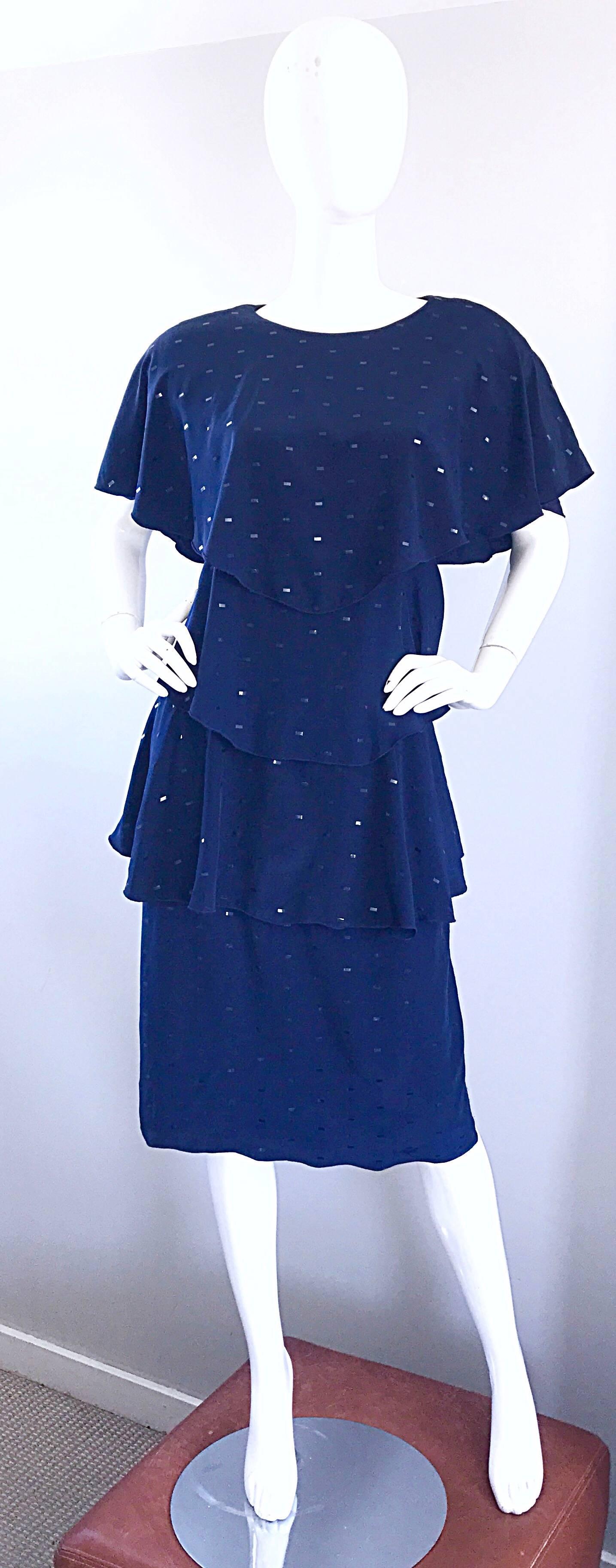 Beautiful vintage HOLLY'S HARP for BERGDORF GOODMAN navy blue flapper inspired dress! Features signature layers of luxurious navy blue silk and black sequins throughout. Button closure at top back neck. Exaggerated shoulders look extra chic and add
