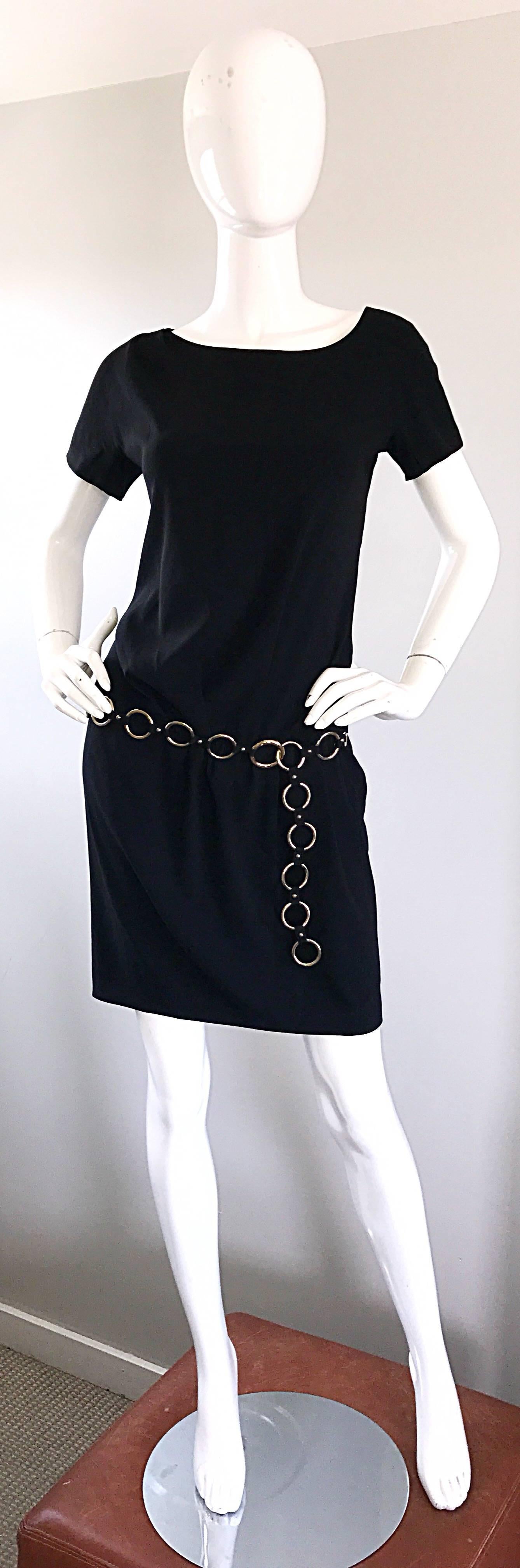 Fantastic vintage 90s MOSCHINO CHEAP & CHIC black dress, with attached silver loop link belt! Intricate detail, with flattering drapes and gathers throughout. Attached belt can be adjusted to fit. Hidden zipper up the side with hidden snap closures.