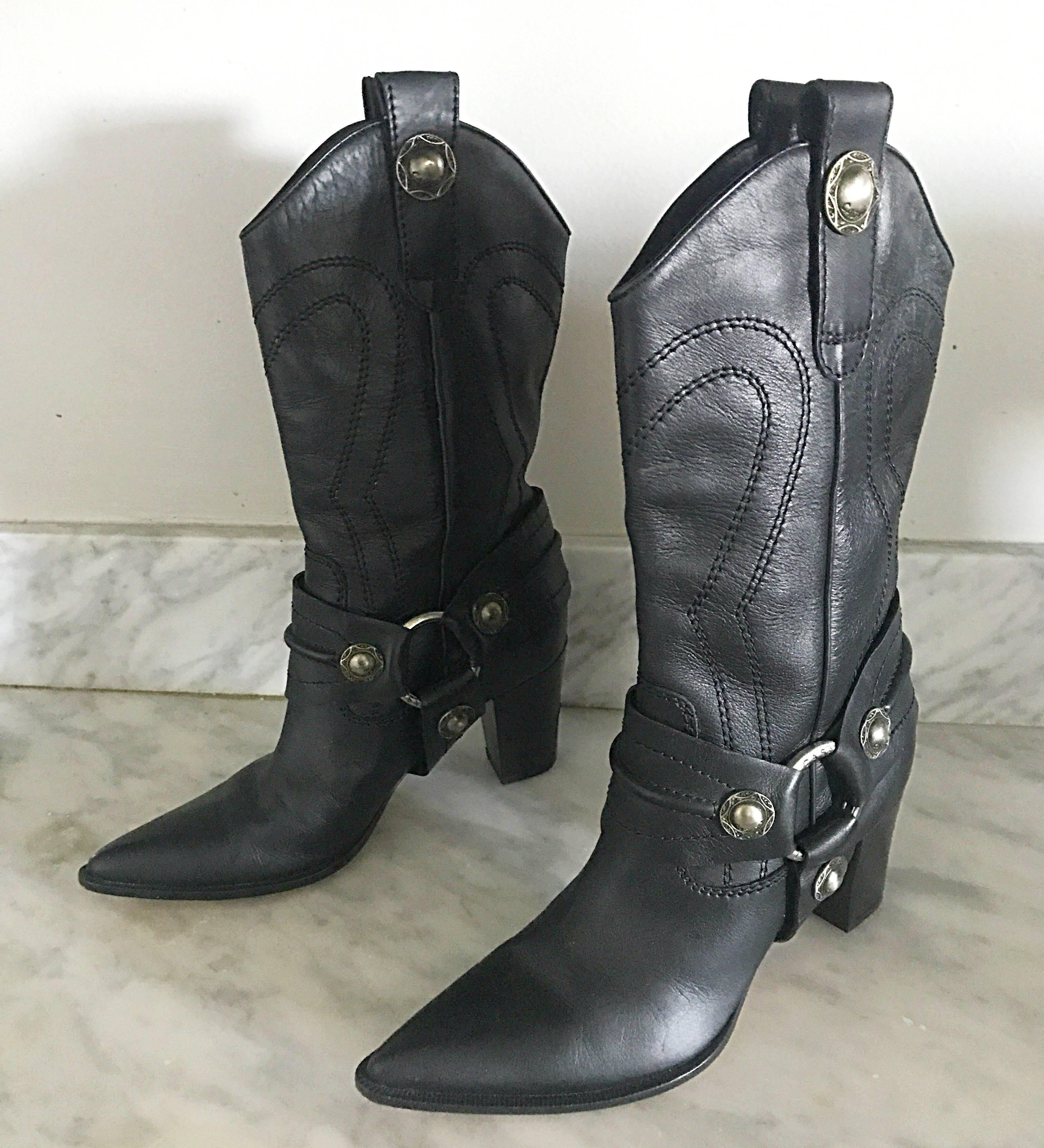 New and sold out CASADEI black leather western inspired high heeled cowboy boots! Features intricate silver hardware, and black embroidery throughout. Hits mid-calf, and can easily be worn with jeans, shorts, a skirt, or a dress. Super comfortable,