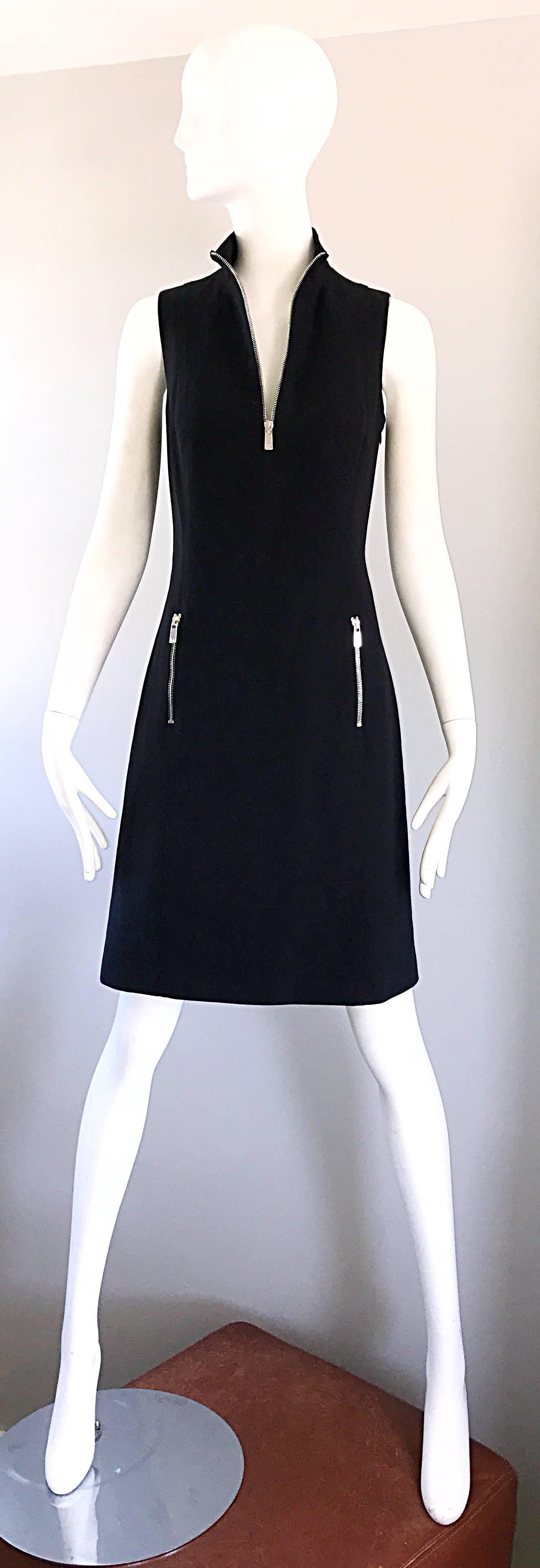 Brand new with tags MICHAEL KORS COLLECTION Runway black sheath dress! Functional silver zipper up the bodice, and at each side pocket. Stretch cotton flatters the body. Neck can be worn zipped up or left open. The perfect little black dress ( LBD )