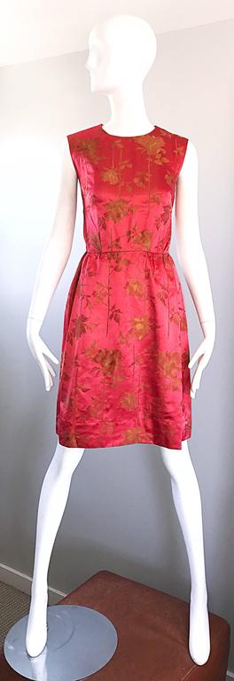 Stunning mid/late 1950s DYNASTY for I. MAGNIN raspberry red and gold silk satin sleeveless demi couture dress! Not quite red, and not quite pink, this beautiful gem features gold embroidered silk Asian influenced flowers throughout. Fitted bodice