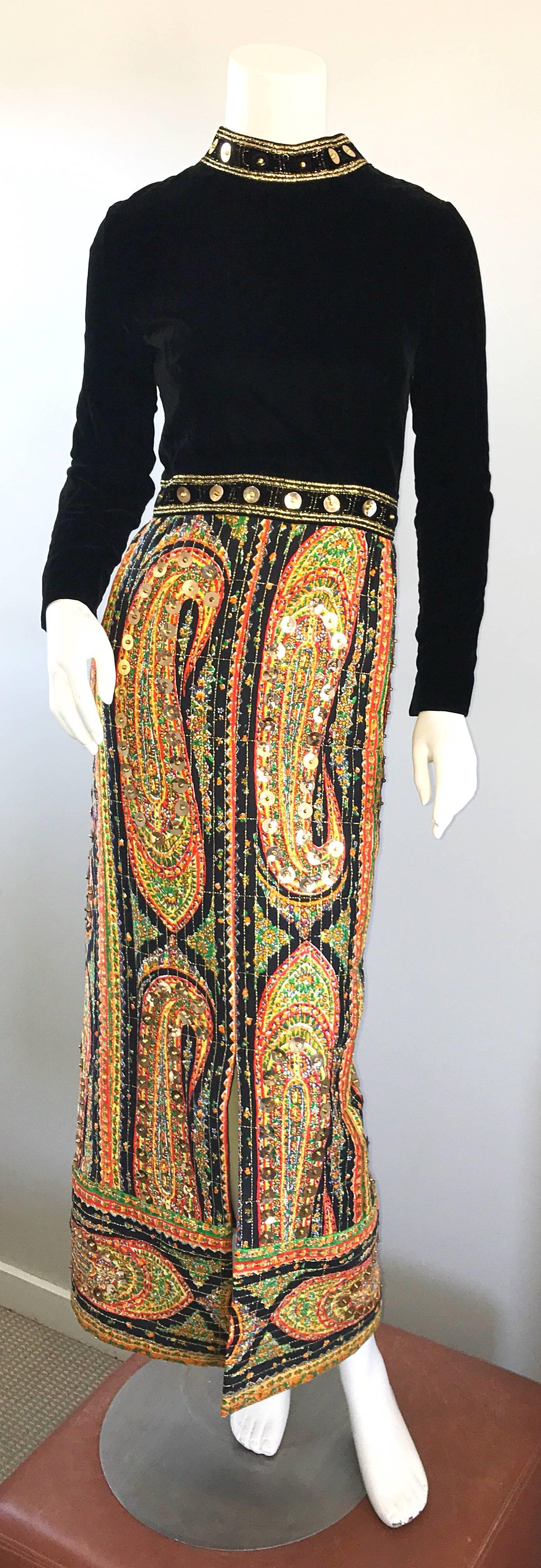 Incredible vintage 1960s PAT SANDLER paisley maxi dress! Features a tailored black velvet bodice adorned with gold sequins and beads on the collar and skirt. Quilted cotton skirt features vibrant green, yellow, red, orange and black paisley