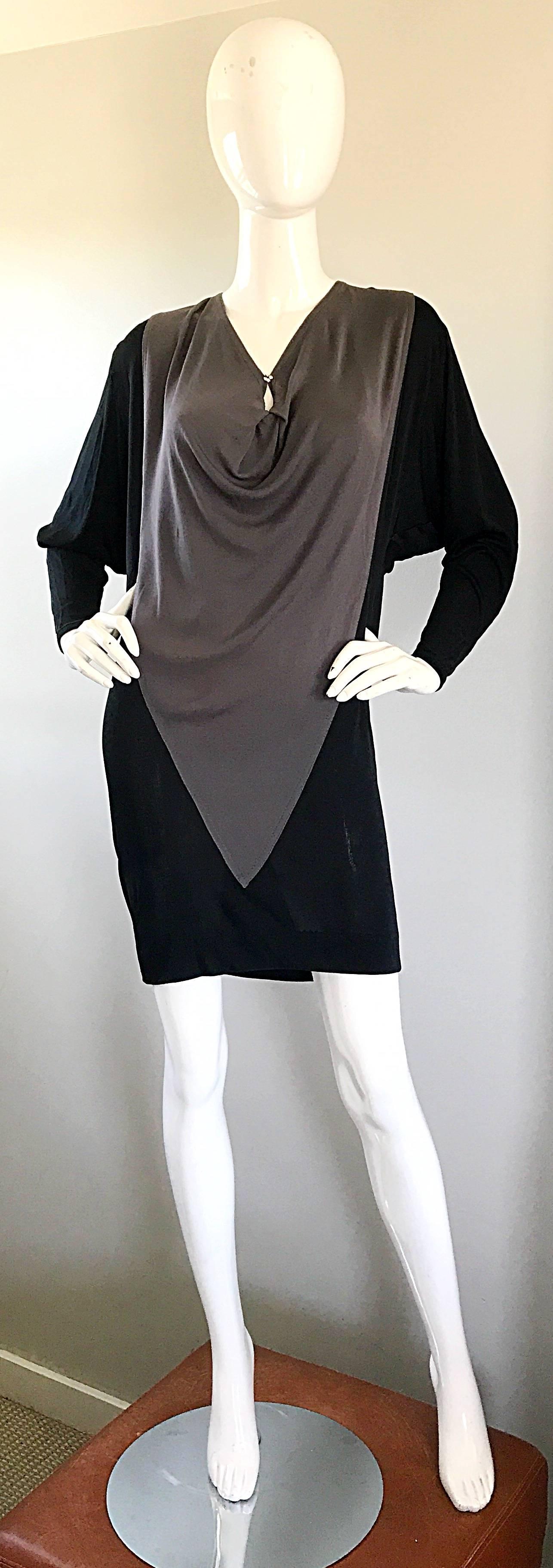 Chic vintage C.D Greene late 90s black and grey color block rayon jersey dress! Chic slouchy flattering fit can accomodate an array of sizes. Features a peek-a-boo back with ties that have rhinestone balls at the end of each string. Matching