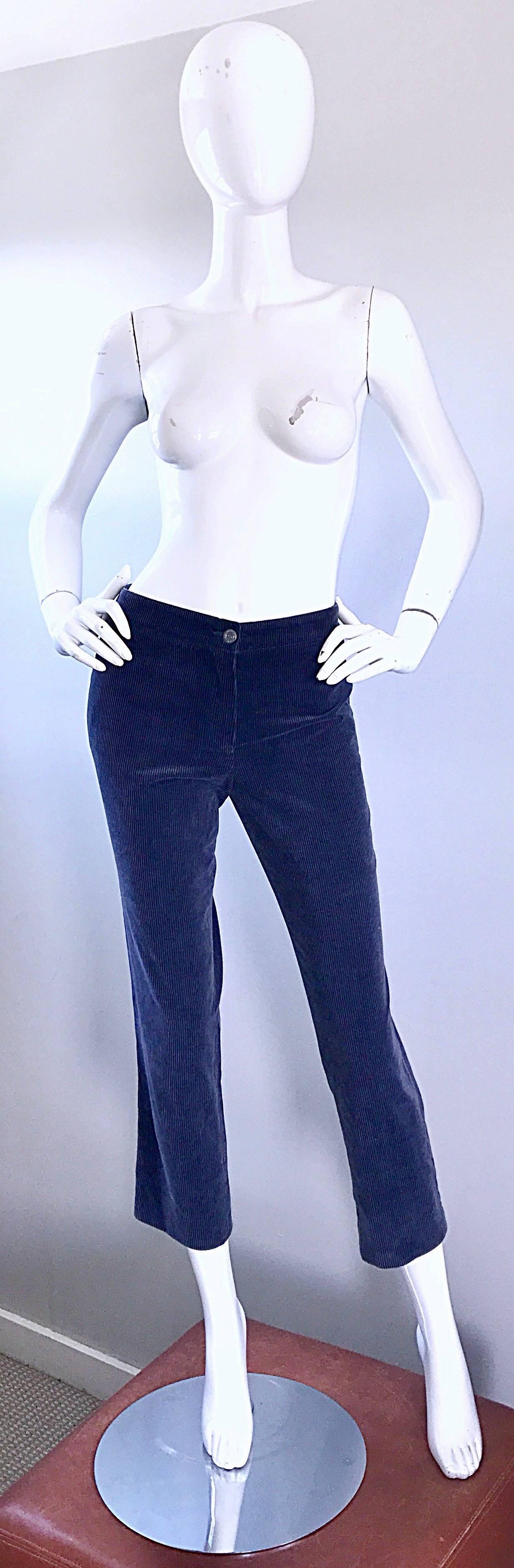Chic CHANEL light navy blue corduroy mid rise slim fit Capri pants from the 2003 collection! Flattering slim fit looks amazing on! One pocket on the rear. Zipper fly with Chanel embossed button on the waistband. Can easily be dressed up or down.