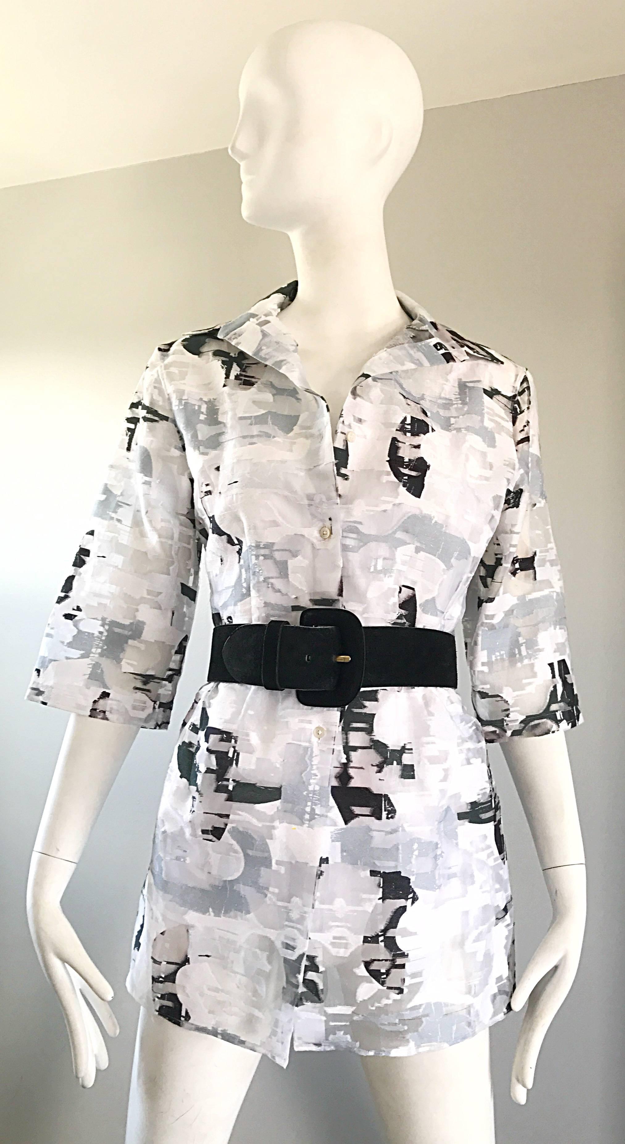 Brand new with tags vintage 90s JIL SANDER black, white and gray abstract print semi sheer blouse! Features a black and white abstract print with grey mixed in. Attached white interior shell. Buttons up the bodice. Great belted or alone. In great
