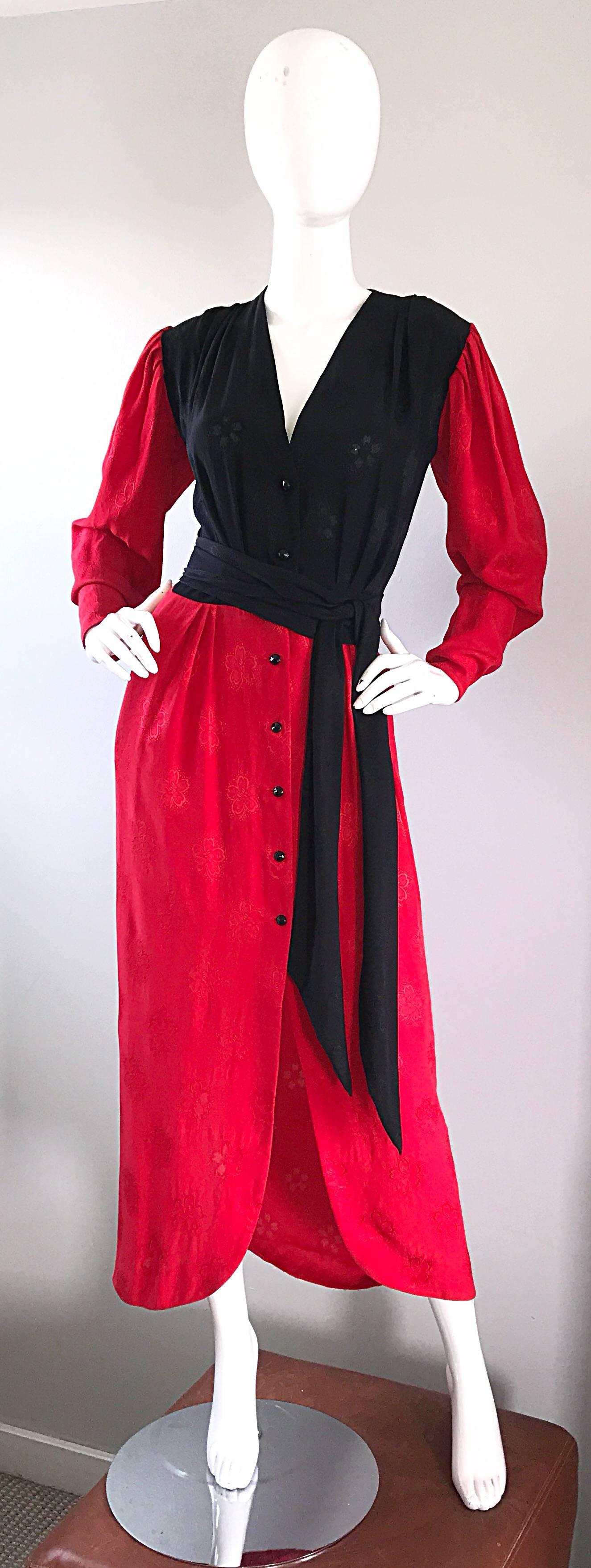 Beautiful vintage EMANUEL UNGARO red and black color blocked evening dress and matching sash belt! Features luxurious Italian silk with flowers embossed throughout. Black lacquer buttons up the front with two hidden  hook-and-eye closures at waist.