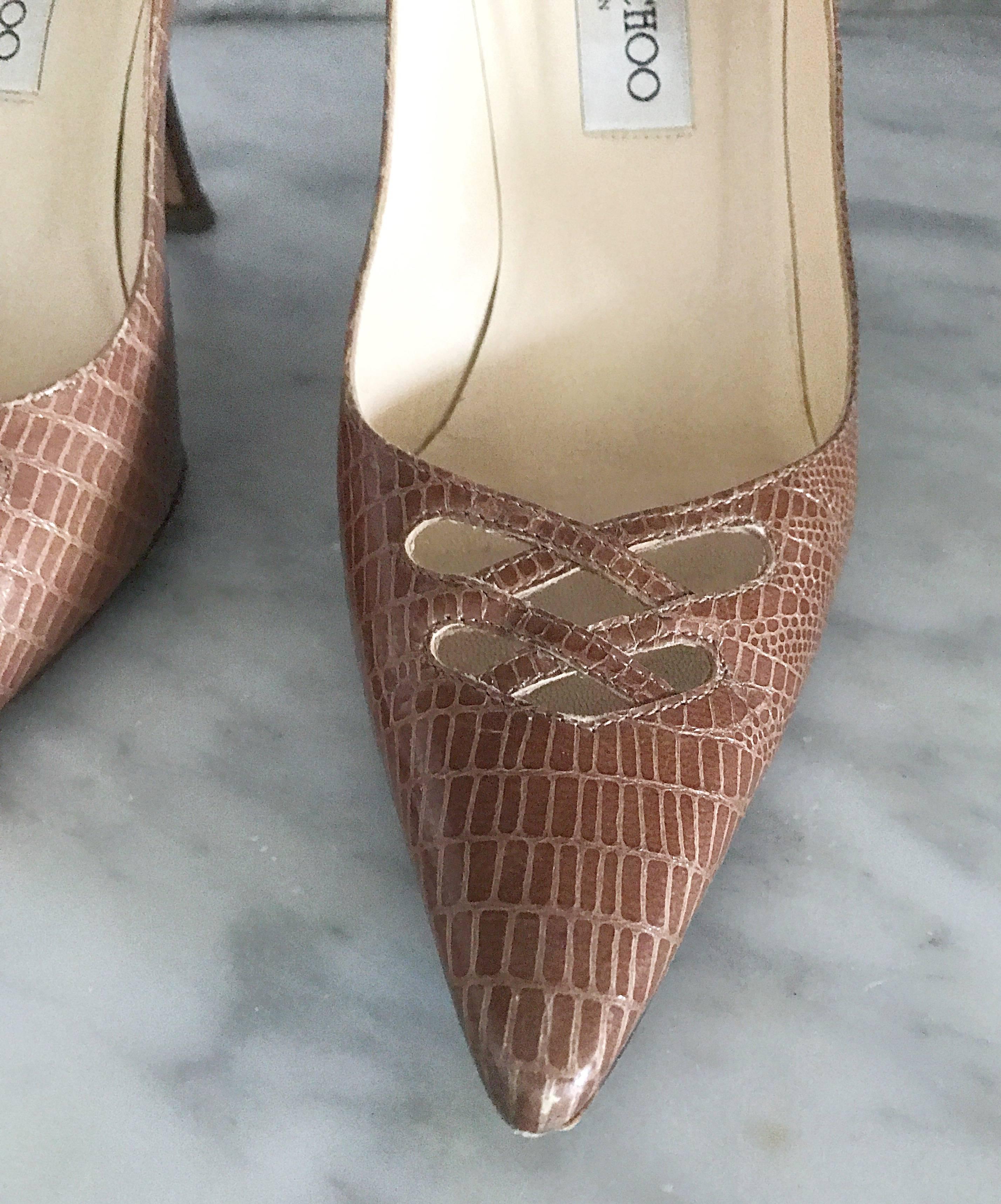 Sexy, sophisticated, stylish and comfortable JIMMY CHOO tan light brown lizard skin embossed stilettos! Features cut-out detail above the toes. 4.5 inch heels with a cushion toe pad. Can easily be dressed up or down. Great with jeans, or perfect