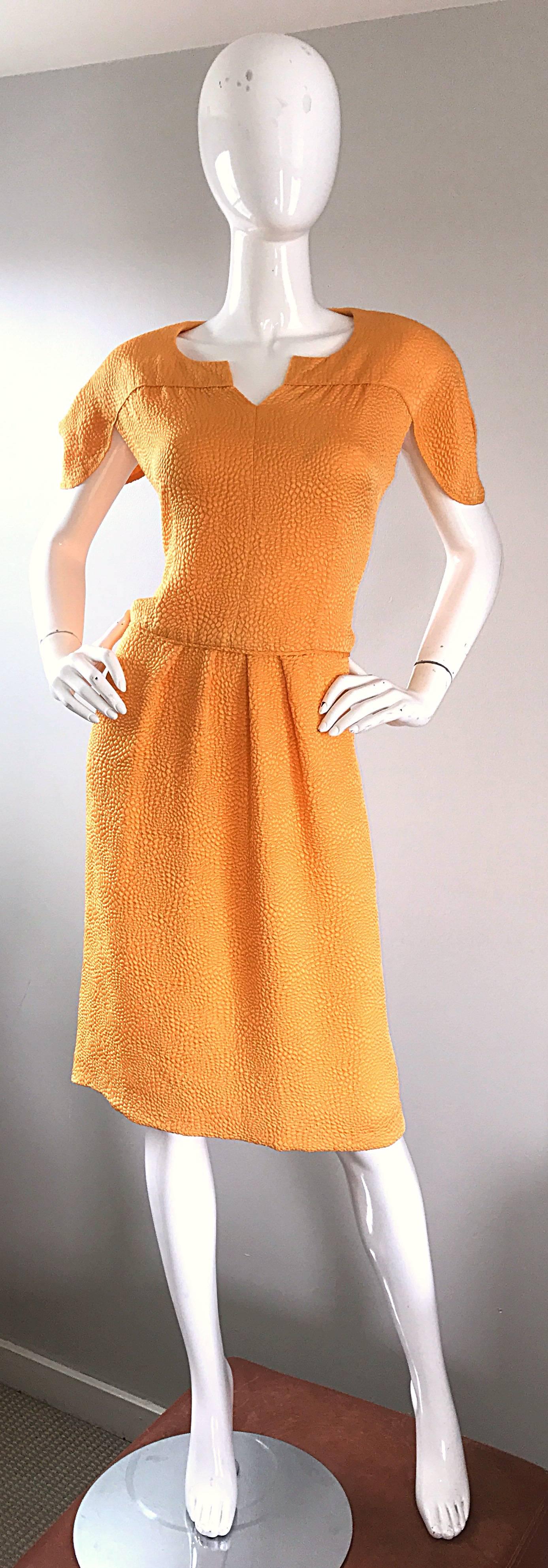 New with original $4,200 price tag from NEIMAN MARCUS! Beautiful vintage 90s RIPETTA ROMA marigold yellow silk short sleeve dress! Features textured silk. Avant Garde petal sleeves. Hidden zipper up the back with hook-and-eye closure. Built in