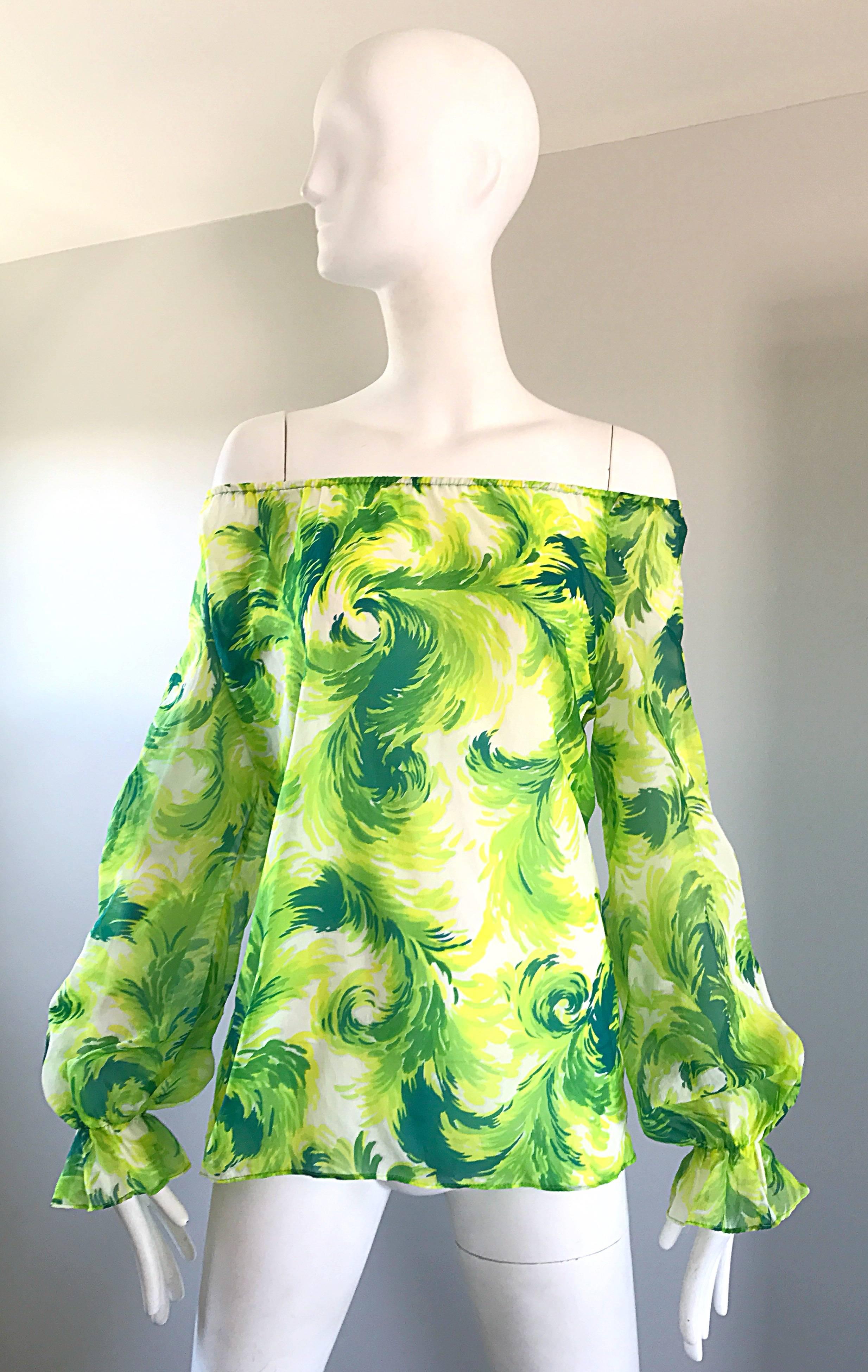 Incredible vintage 1970s green and white feather print off-the-shoulder boho blouse! Features fabulous feathers in vibrant green and lime green throughout. Sits off the shoulder, but could also be worn up as well. Great belted or alone with shorts
