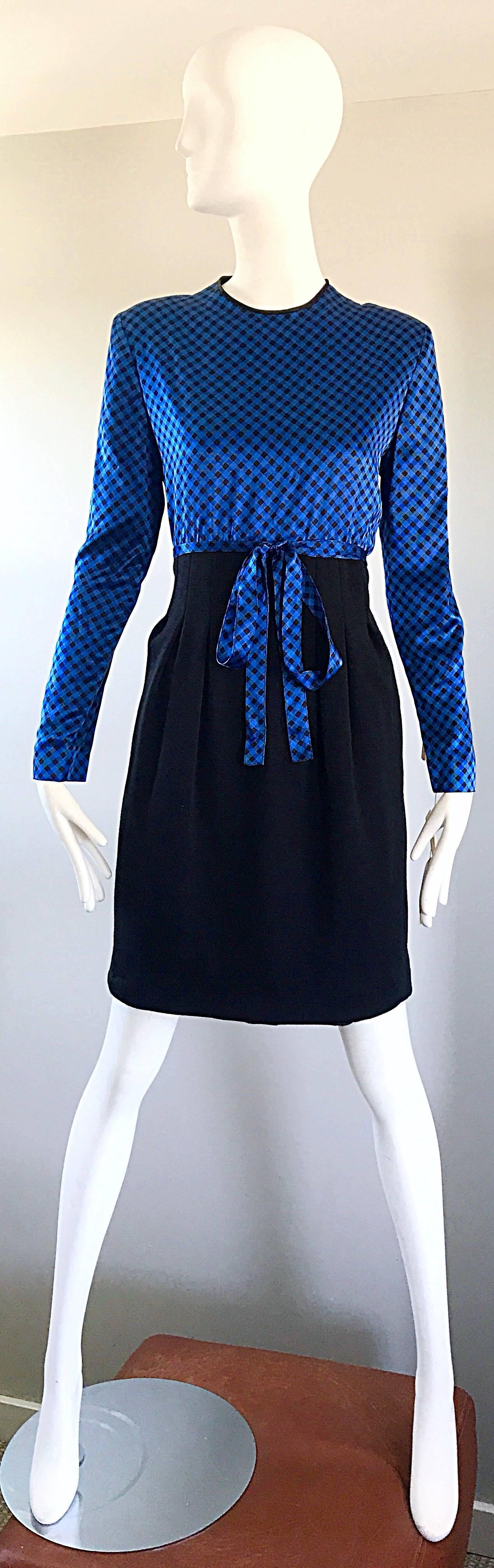 New with tags chic vintage 90s GEOFFREY BEENE (Mr Beene) dress! Features a royal blue and black gingham fitted silk bodice and a black virgin wool pencil skirt. Pockets at each hip. Attached tie belt can be tied in the front or back (as shown in