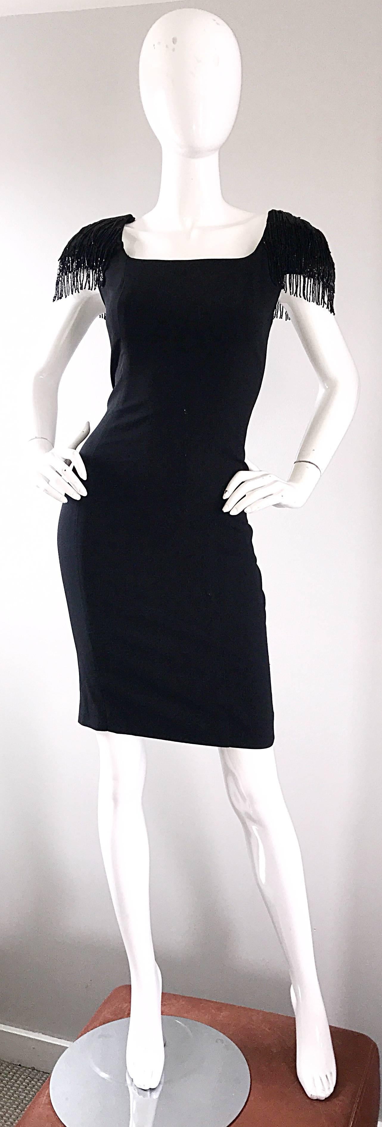 The perfect little black dress! Flattering body hugging fit looks amazing on! Cap sleeves features strands of black beaded fringe. Full lined. Hidden zipper up the back with hook-and-eye closure. Great belted or alone for any day or evening event.