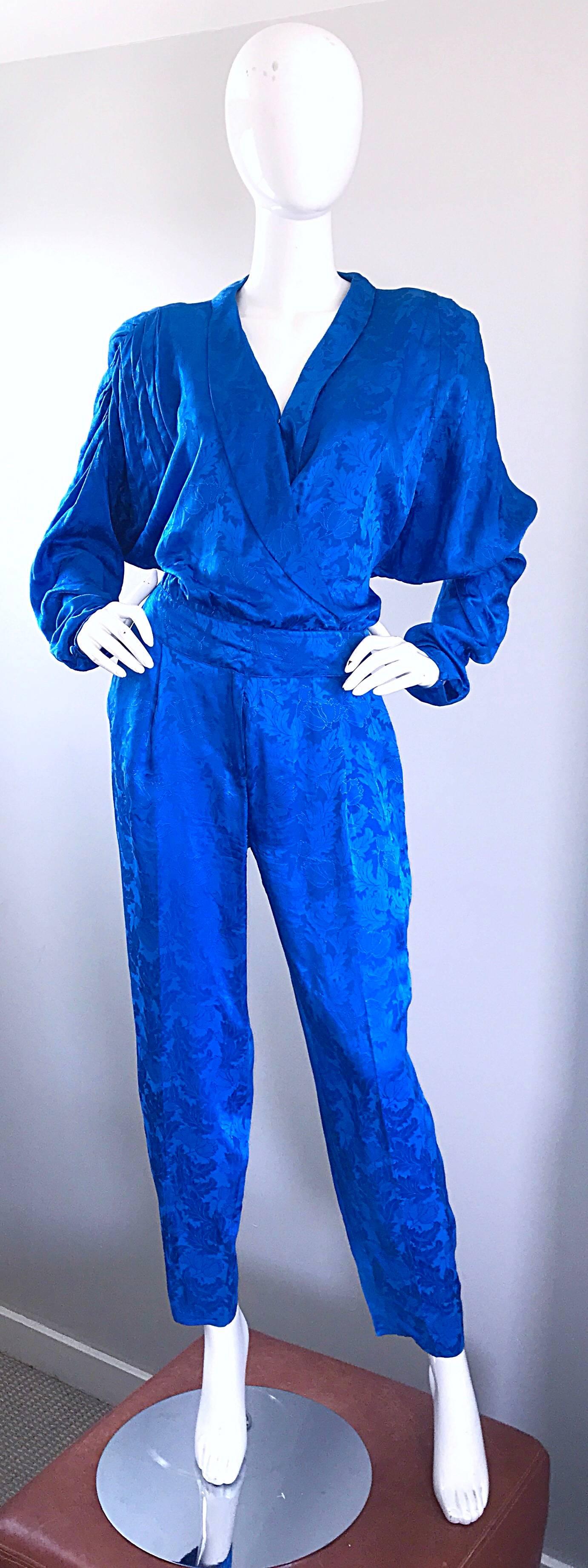 Amazing vintage 80s FLORA KUNG royal blue silk jumpsuit! Buttons up the bodice, with interior buttons to keep everything in place. Snap at bust can be snapped shut or left open for a little extra cleavage. Zipper fly. Chic dolm,an sleeves can