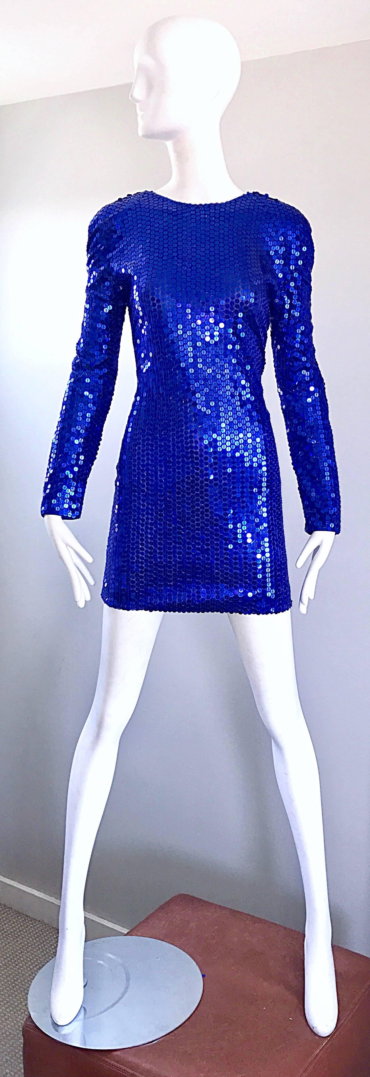 Sexy 1990s LILLIE RUBIN royal blue sequined long sleeve bodycon mini dress. Wonderful tailored fit with a low cut back. Hidden zipper up the back with hook-and-eye closure. Great belted or alone with heels or boots. Super comftorable jersey