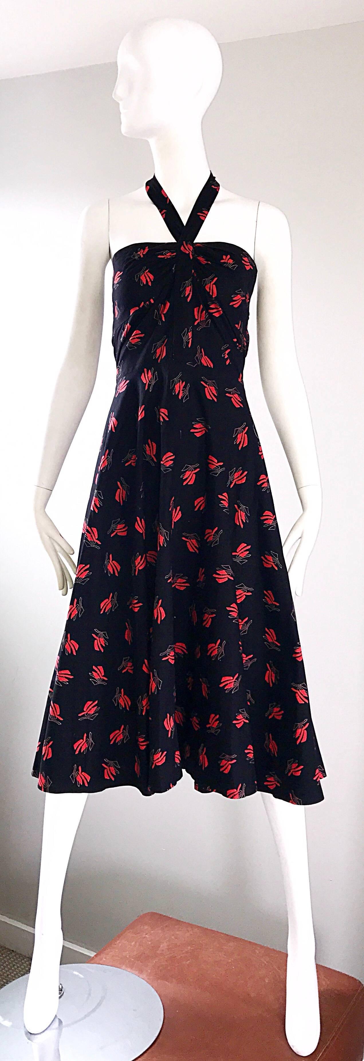 Smashing vintage GUY LAROCHE Oriental themed cotton halter sun dress! Features a black body, with an amazing red fan-like print throughout. Flattering fitted bodice, with a nice forgiving full skirt. Halter style ties at the back neck. Hidden zipper