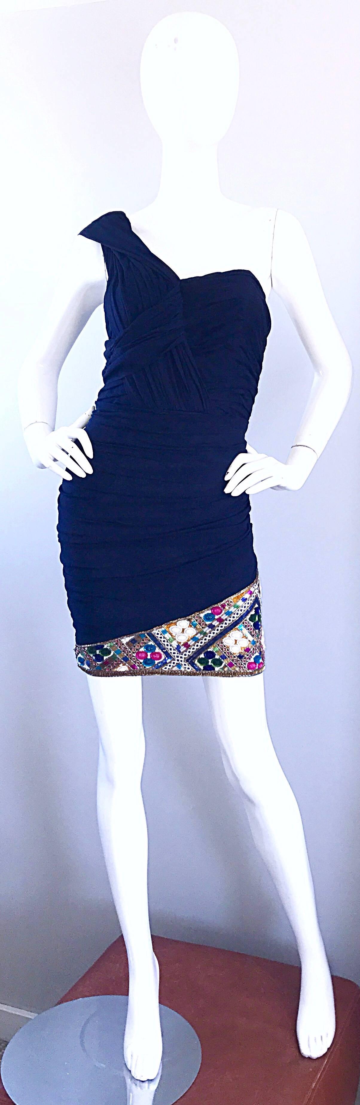 Stunning 1990s PAUL LOUIS ORRIER navy blue silk chiffon one shoulder Grecian toga mini cocktail dress! Flattering ruched bodice and body, with an asymmetrical sleeve that attaches to the back with a snap. Interior boning holds everything in place.