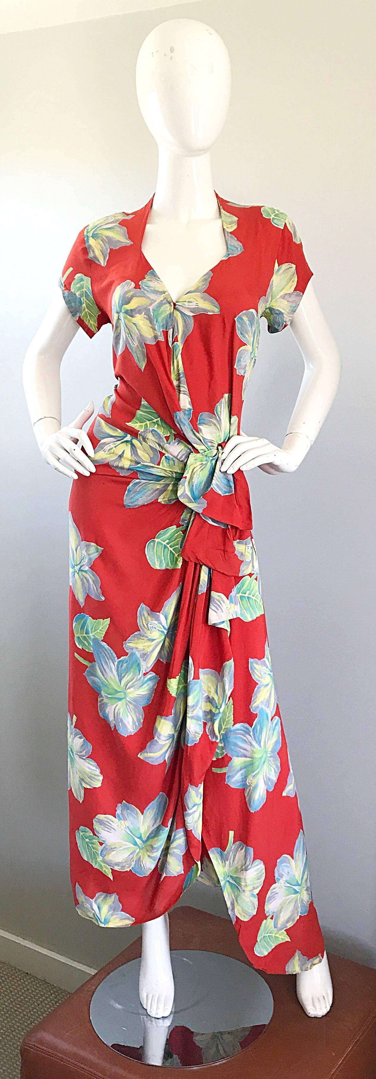Gorgeous 1930s cold silk couture Hawaiian full length dress! Drapes over the body beautifully. Wrap style with interior hook-and-eye closure at the waist. Vibrant burnt orange color with large flowers printed throughout in white, blue, green and