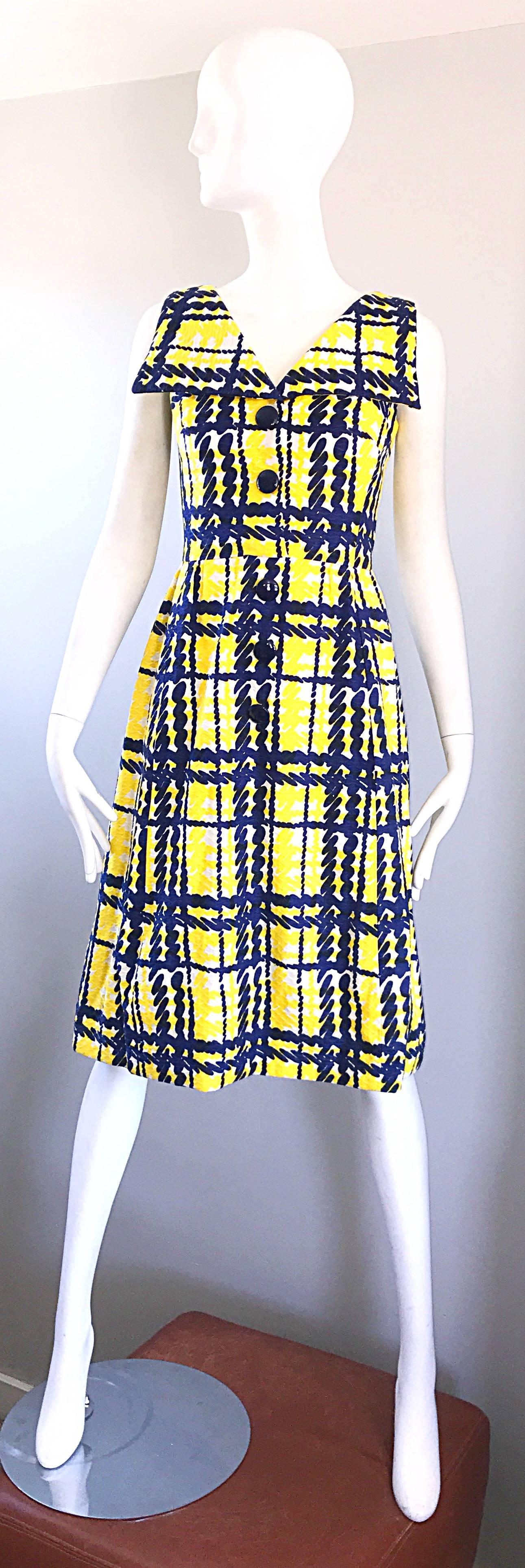 Chic 60s vintage ALAN PHILLIPS navy blue, yellow and White A line dress! Features a unique plaid print, with a nautical collar. Navy lacquer buttons up the bodice. Hidden metal zipper up the back with hook-and-eye closure. Nice textured cotton holds