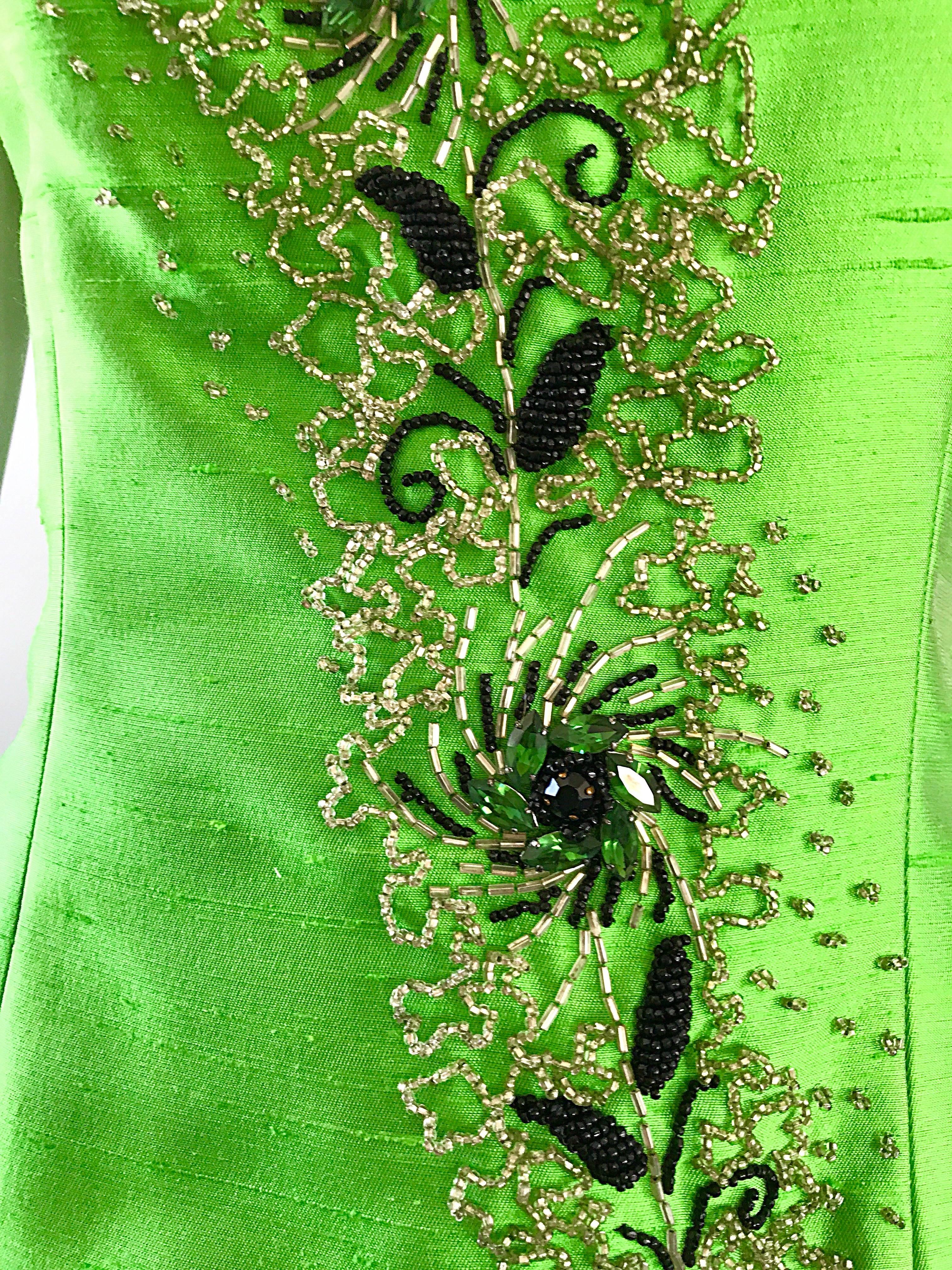 Stunning 1950s green raw silk shantung couture beaded top! Features hundreds of hand-sewn beads and crystals throughout the front bodice. Full metal zipper up the back with hook-and-eye closure. Heavy attention to detail, with couture quality.