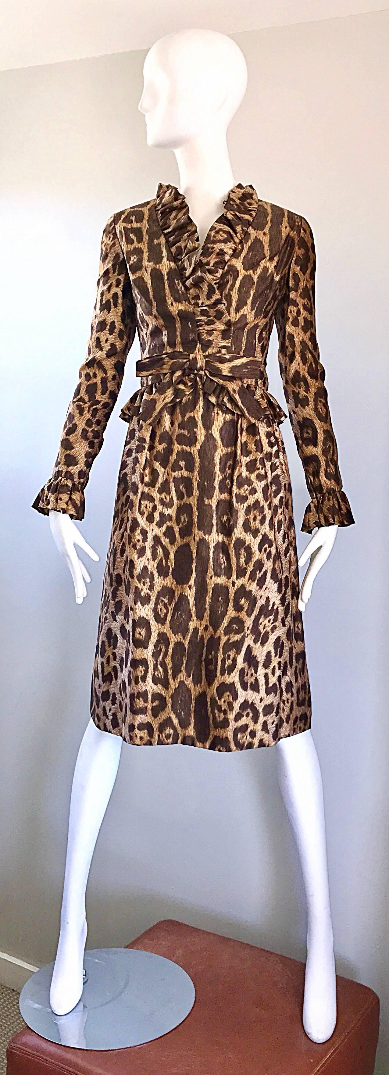 Chic 1960s MOLLIE PARNIS leopard cheetah print long sleeve silk A-Line dress! Fitted bodice with a flattering full skirt. Ruffles at collar, waist, and each sleeve cuff. Bow at center waist. Full metal zipper up the back with            hook-and-eye