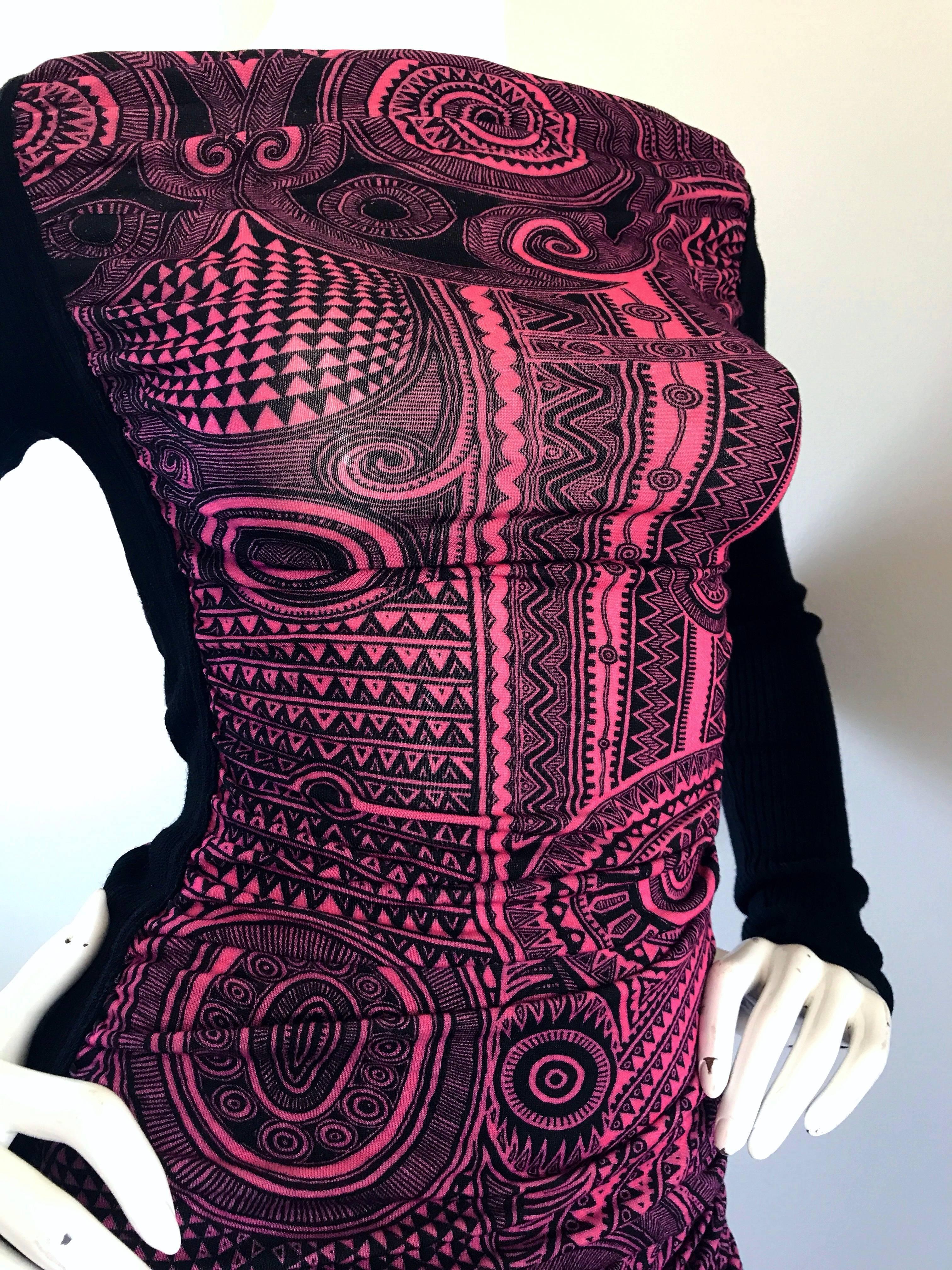 Rare 1990s JEAN PAUL GAUTLIER hot pink and black Aztec zodiac print top and skirt set! Features a vibrant hot pink and black Aztec zodiac print throughout. Soft stretchy rayon fabric with black virgin wool panels at each side of the blouse and
