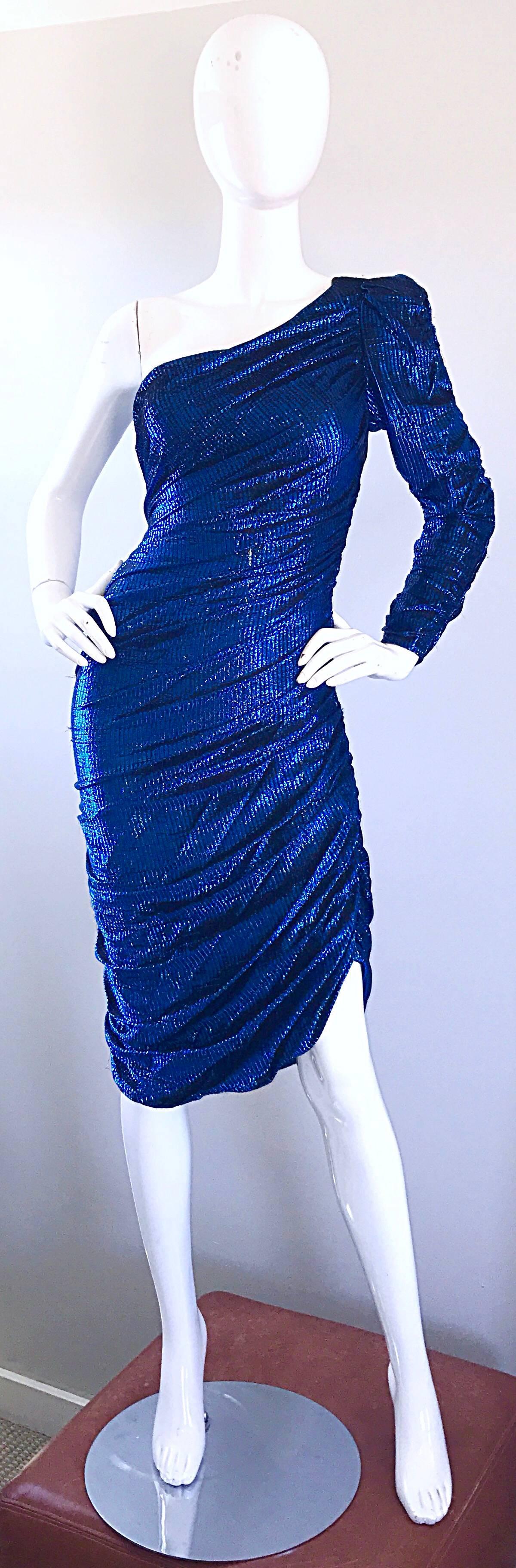 Sexy 1970s SAMIR electric blue metallic bodycon one shoulder disco dress! These dresses are so rare to come by, and I have had the privilege of owning two before. They each sold in a heartbeat. However, this is a much rarer larger size! Hidden