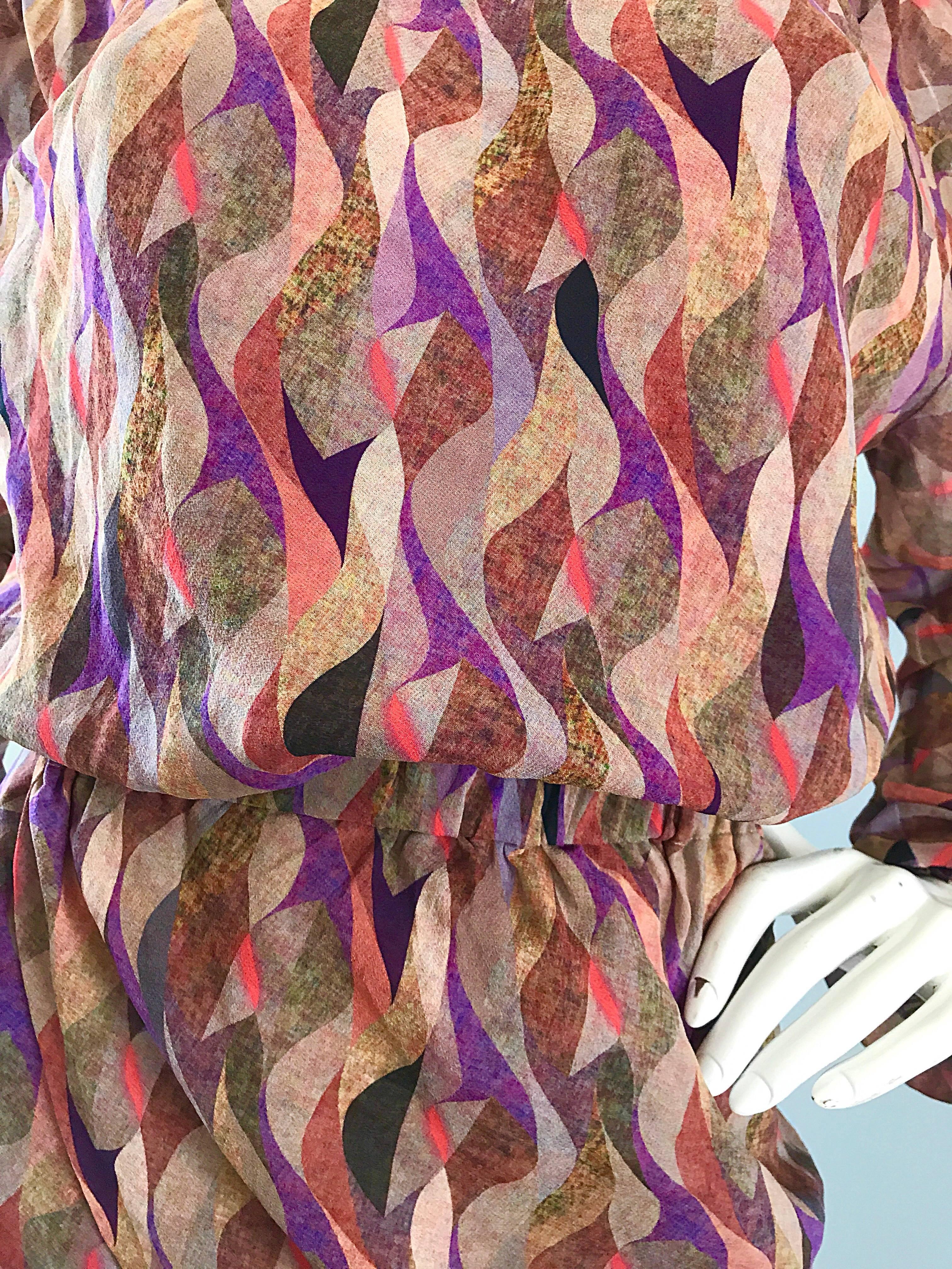 Beautiful new NINA RICCI vintage mosaic print long sleeve off-the-shoulder silk boho dress! Features warm tones of purple, pink, brown, tan and sand throughout. Elastic neckline can either be worn off the shoulder, or up (see photo). Asymmetrical