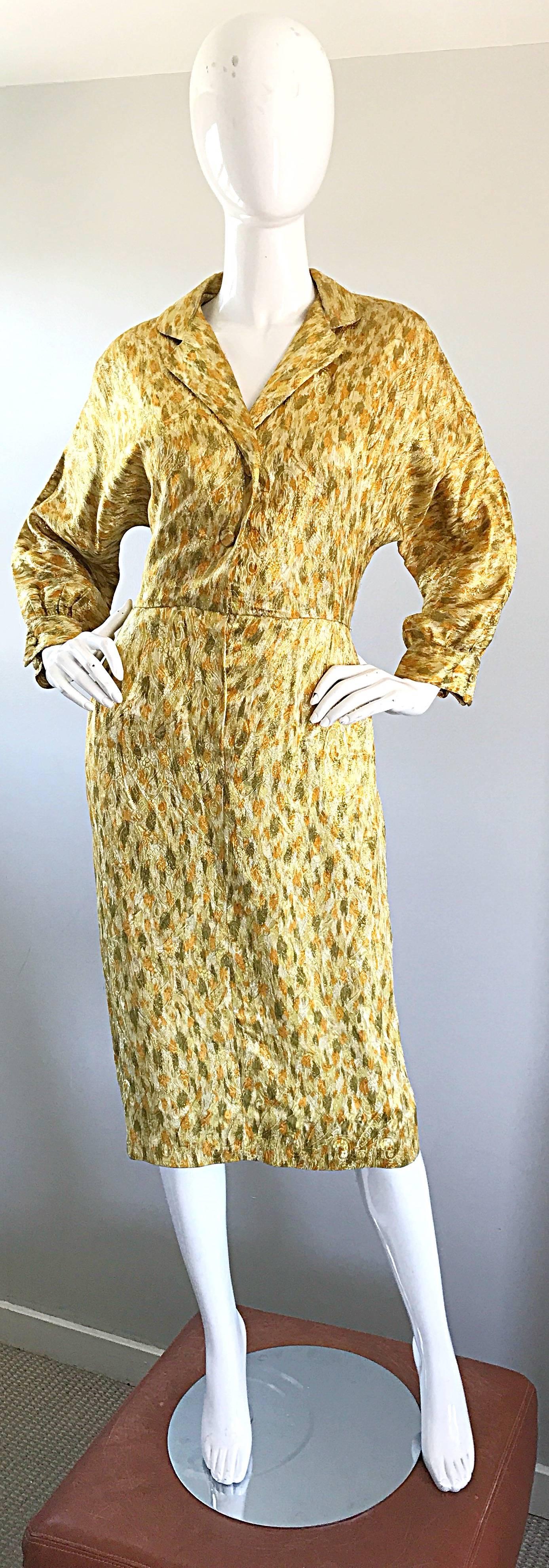 Stunning 1950s NORMA MORGAN yellow, chartreuse green, and bronze silk long dolman sleeve dress! Features a unique print of abstract leopard with metallic paisley. Mock buttons up the bodice with hidden snap closures. Hidden metal zipper up the