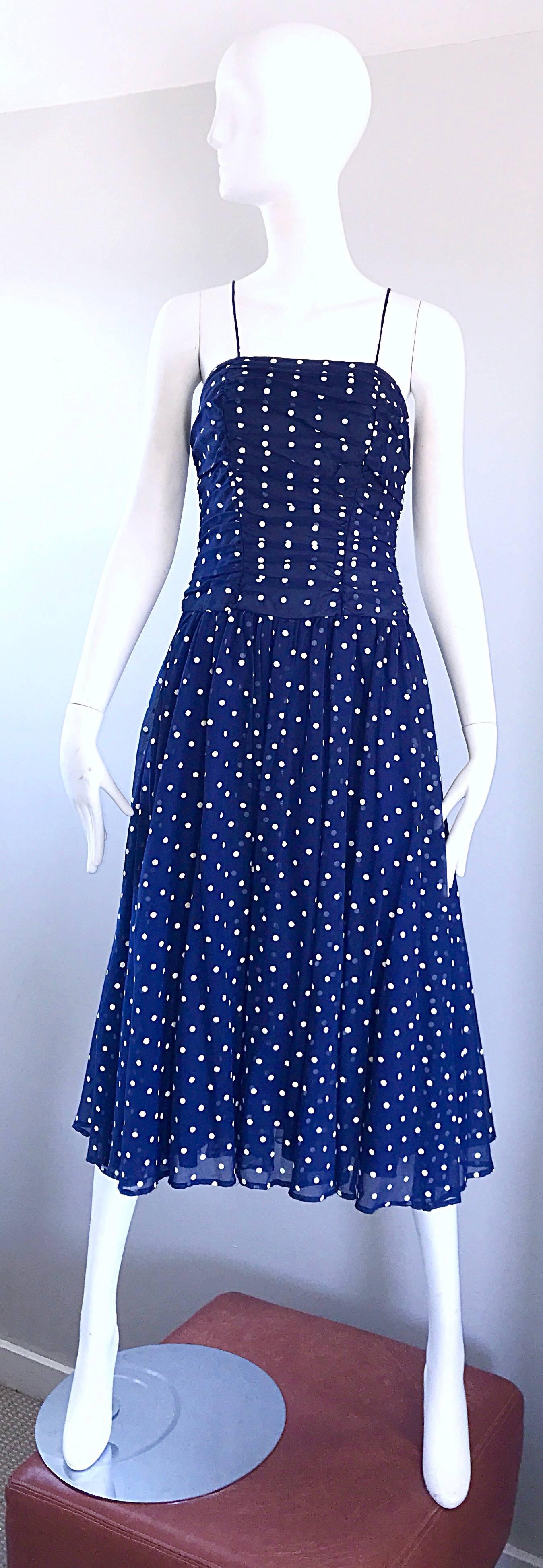 Chic vintage navy blue and white hand painted flirty spaghetti strap midi dress! Features a flattering ruched bodice and a forgiving full skirt. Layers of the skirt give the perfect flowy effect when worn. Fantastic quality with no designer labels