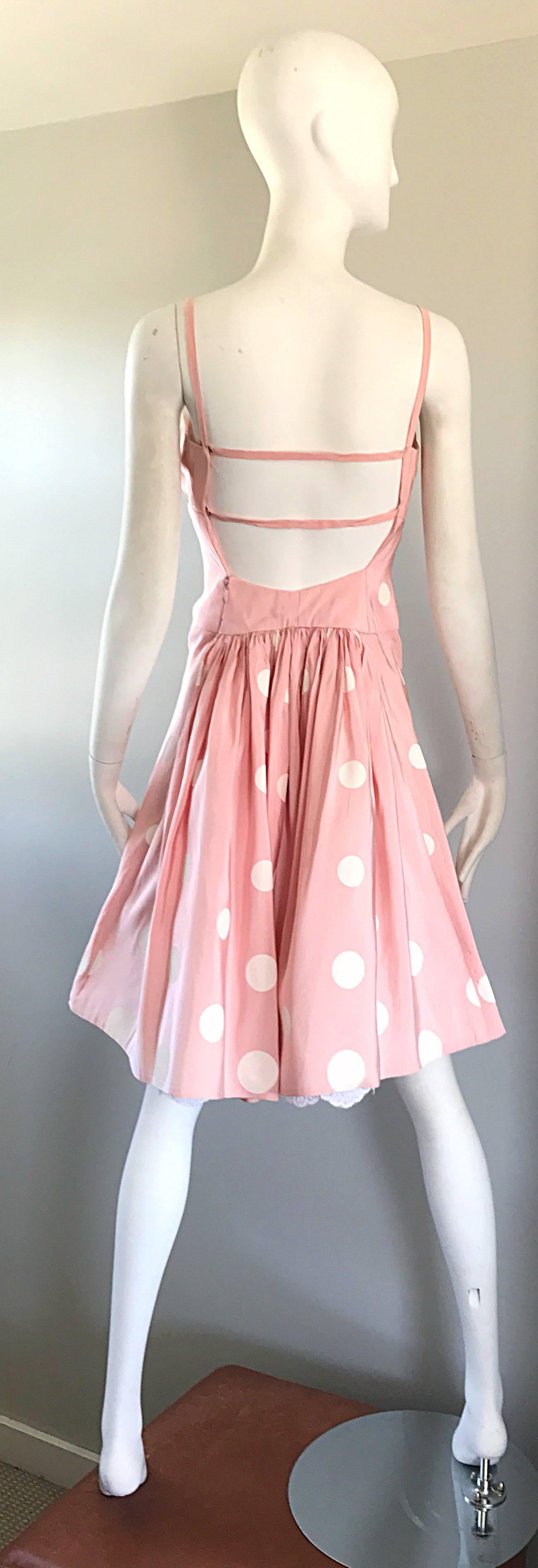 Chic 90s BILL BLASS pale pink and white hand painted polka dot fit n' flare cocktail silk taffeta dress! Features large handpainted polka dots throughout. Attached white lace underlay peeks through at the back hem. Peek-a-boo back with a center