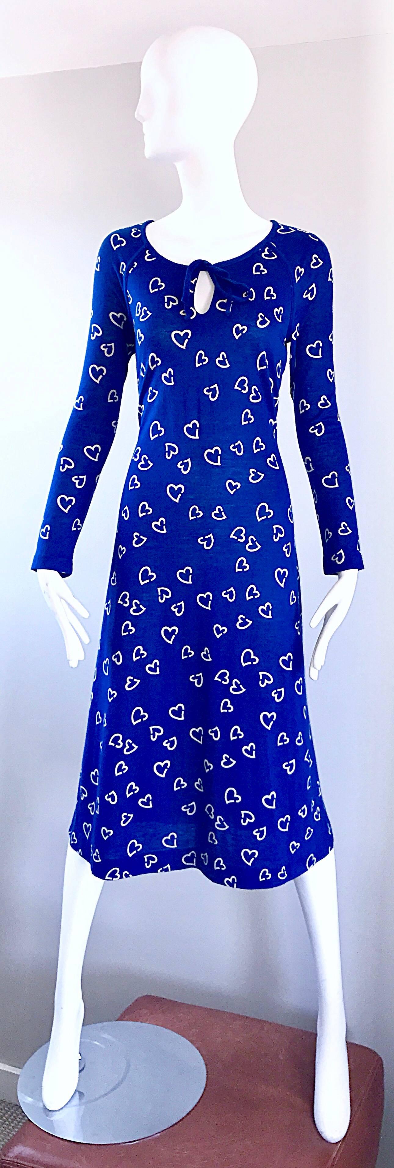 Rare and super chic 1970s DIANE VON FURSTENBERG royal blue and white heart printed long sleeve dress! Rare early 1970s gem from when DVF was just building her fashion empire. Sleek tailored bodice with long sleeves and a full skirt. Keyhole above