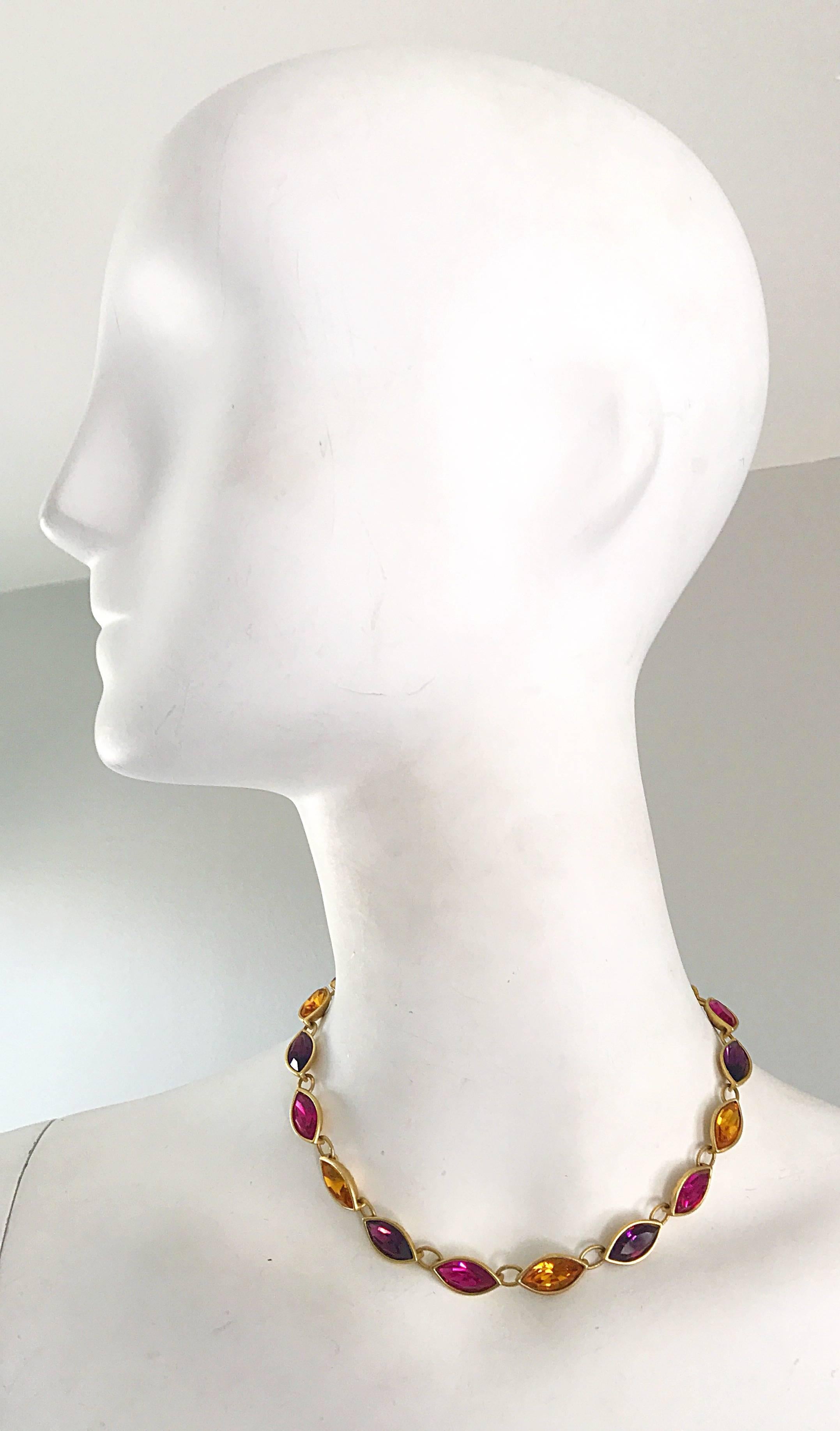 Gorgeous vintage YVES SAINT LAURENT purple, fuchsia pink, and yellow citrine crystal choker necklace! Gold chain with the YSL logo at the clasp. Oval shape crystals sparkle beautifully when hit by light! Can really add just that little extra pop to
