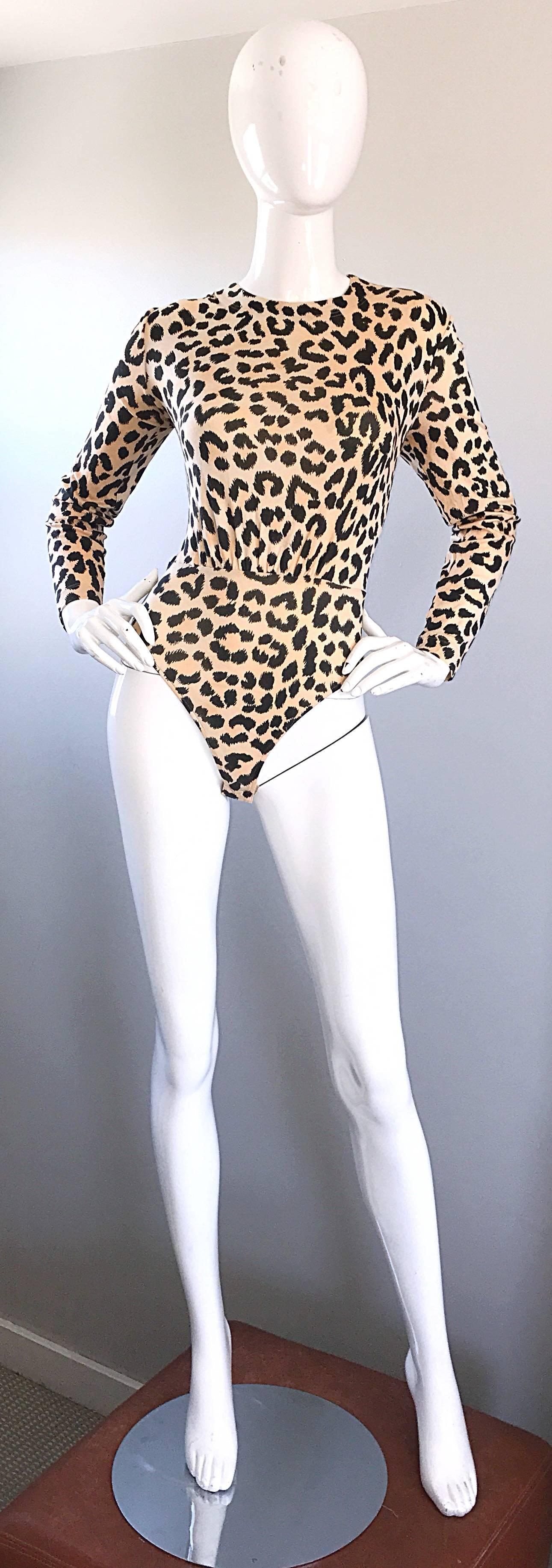 Sexy 1990s ESCADA by MARGARETHA LEY leopard/cheetah animal print long sleeve bodysuit! Body hugging cotton stretches to fit. Adjustable snaps at inner crotch. Hidden zipper up the back. Great with shorts, jeans, trousers, or a skirt. In great