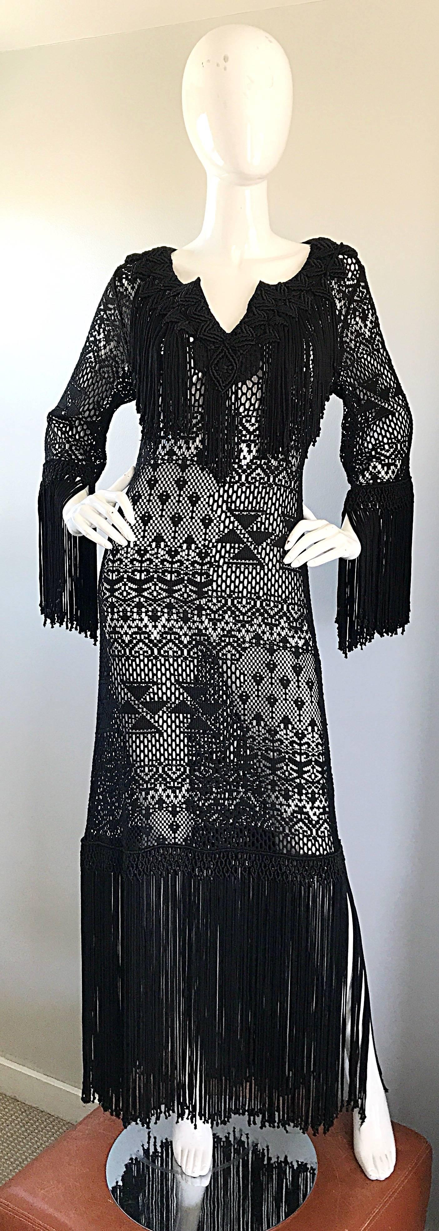 Amazing 1970s hand crochet black open weave fringed couture quality  maxi dress! Incredible amount of details that were completely sewn by hand. Fringe detail at collar, sleeves, and hem. Embrodiered details also at collar and hem (directly above