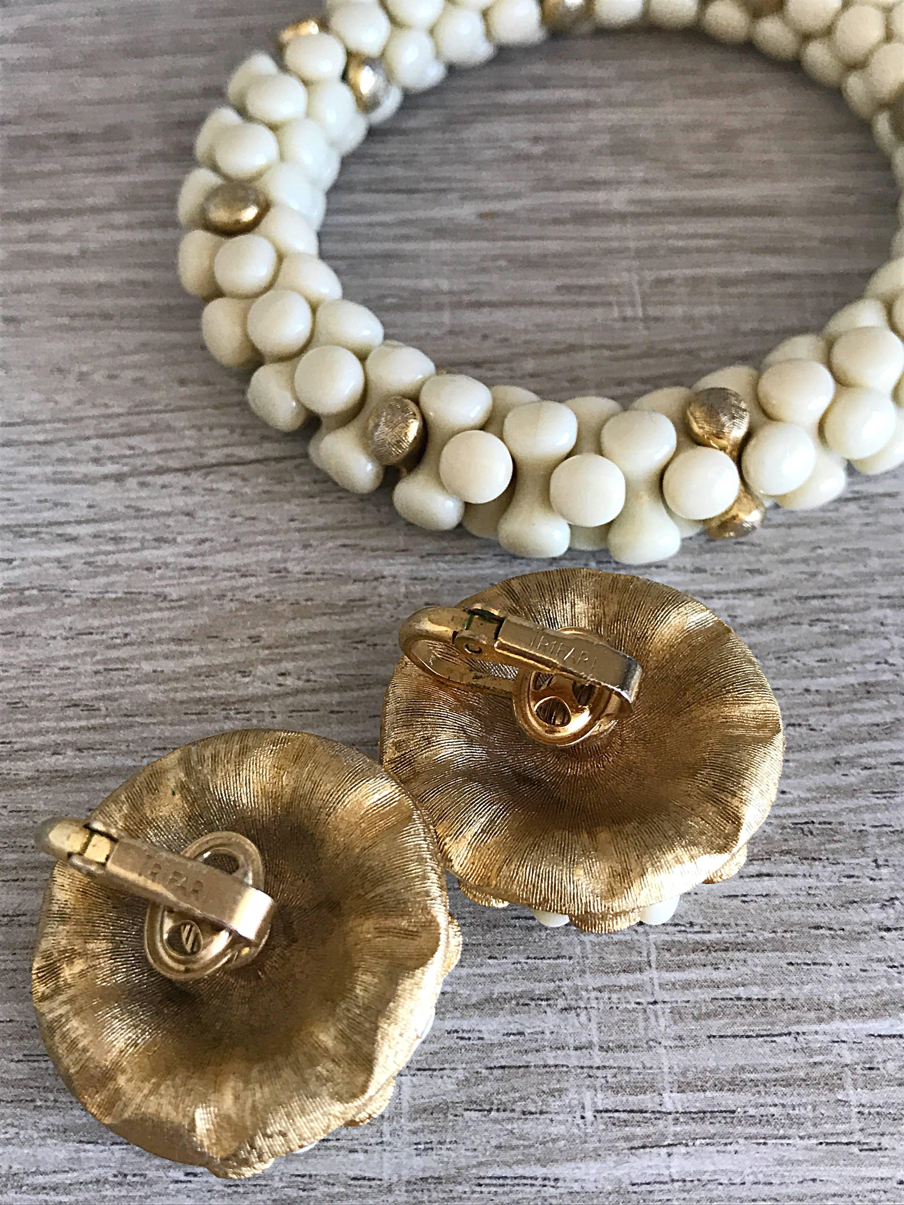 Chic 1960s three piece jewelry set by TRIFARI! Beaded ivory / off-white and gold beaded clip-on earrings and bracelet combination. Perfect all year, and goes with anything! Great with a dress, gown, or jeans. Perfect together or broken up. In great