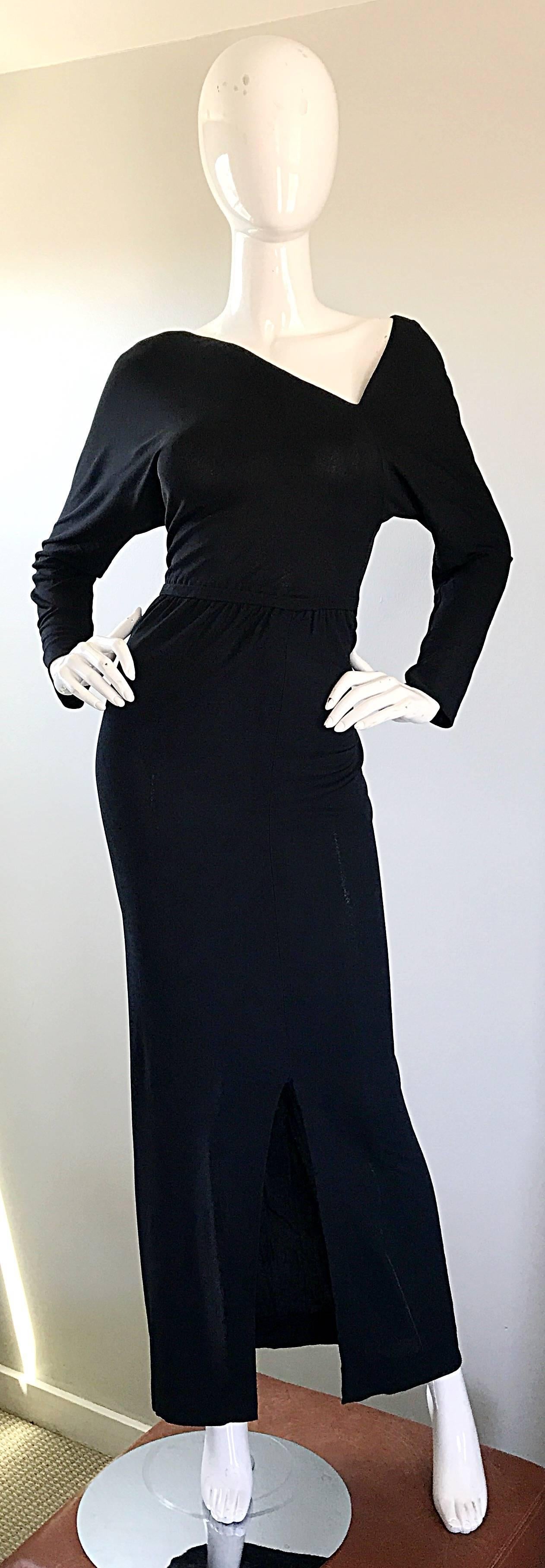 Sensational 1970s HASLTON for I Magnin asymmetrical black crepe rayon jersey evening dress! Features a contrasting asymmetrical neckline on both the front and the back. Simply slips over to head, and features a flattering elastic waistband that