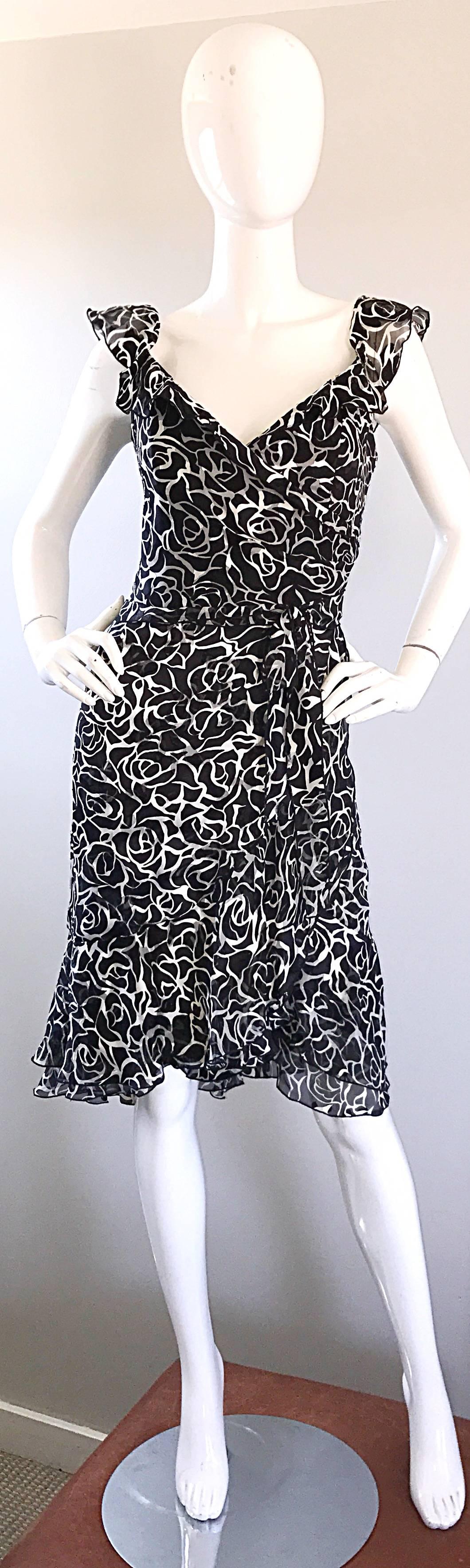 Gorgeous and flirty 1990s LIANCARLO COUTURE for SAKS 5TH AVENUE black and white rose print silk chiffon dress! Features a form fitting boned bodice, and a faux wrap style skirt. Layers and layers of chiffon look wonderful with movement. Flutter