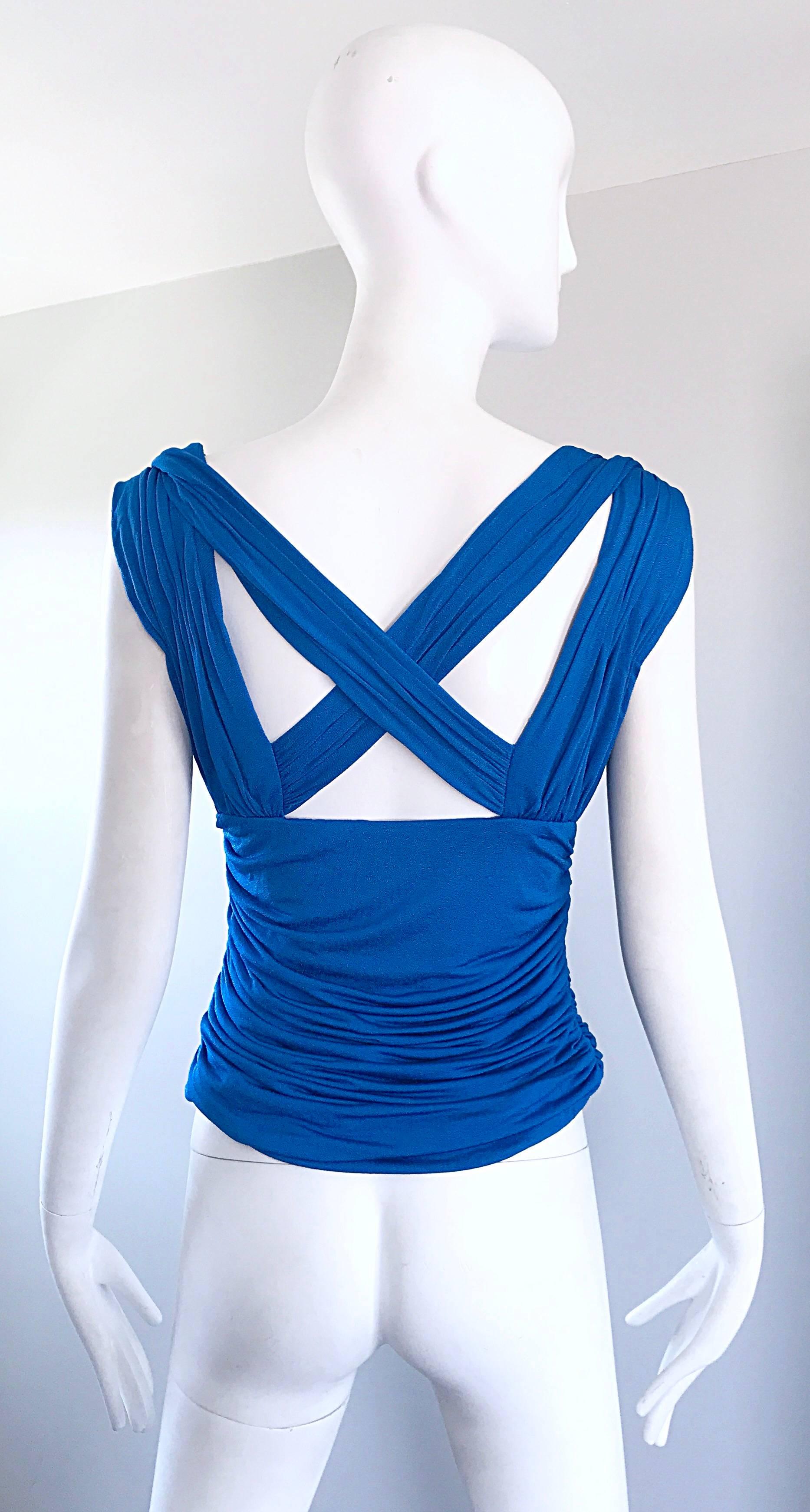 Flattering vintage 90s ESCADA cerulean blue jersey sleeveless criss-cross 
Cut-out back blouse! Beautiful vibrant blue color, and so many flattering details. Features a forgiving stretchy ruched bodice and a sweetheart neckline. Amazing back criss