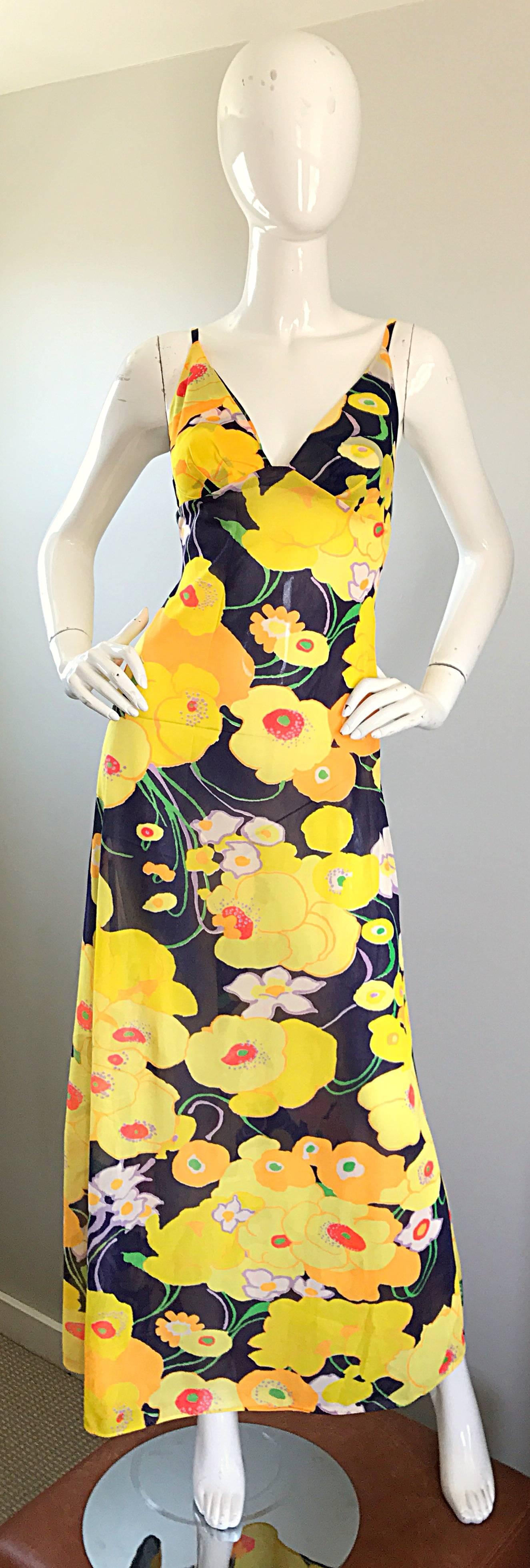 Amazing 1970s CHRISTIAN DIOR / MISS DIOR vibrant colored flower maxi dress and jacket! Features brightly colored flower prints in yellow, navy blue, red, white, lavender purple, green and orange throughout. Maxi dress features a fitted bodice with a