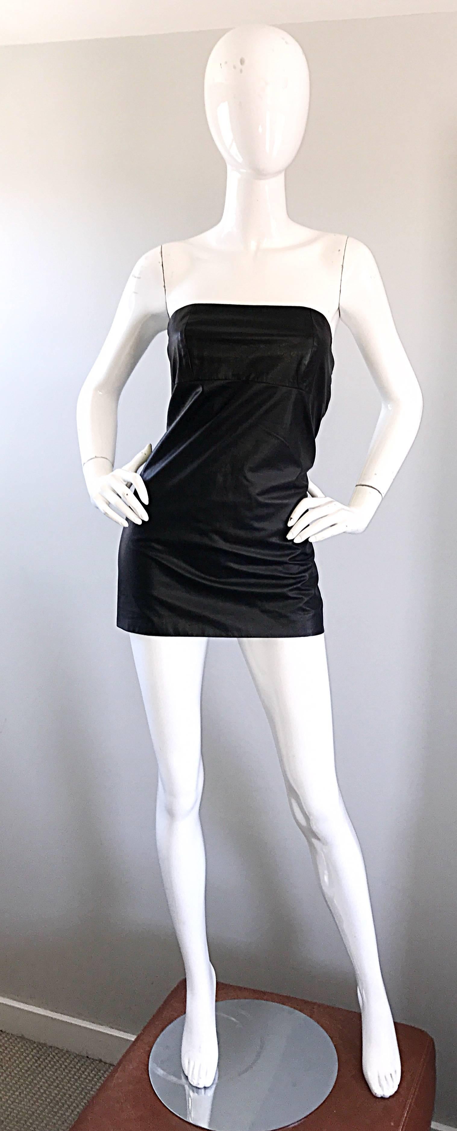 Collectible MAISON MARTIN MARGIELA black leather strapless mini dress or tunic! Features luxurious soft leather on the front, and a stretchy black knit on the back, which provides a bit of comfort and stretch. Great alone, with stockings, and boots