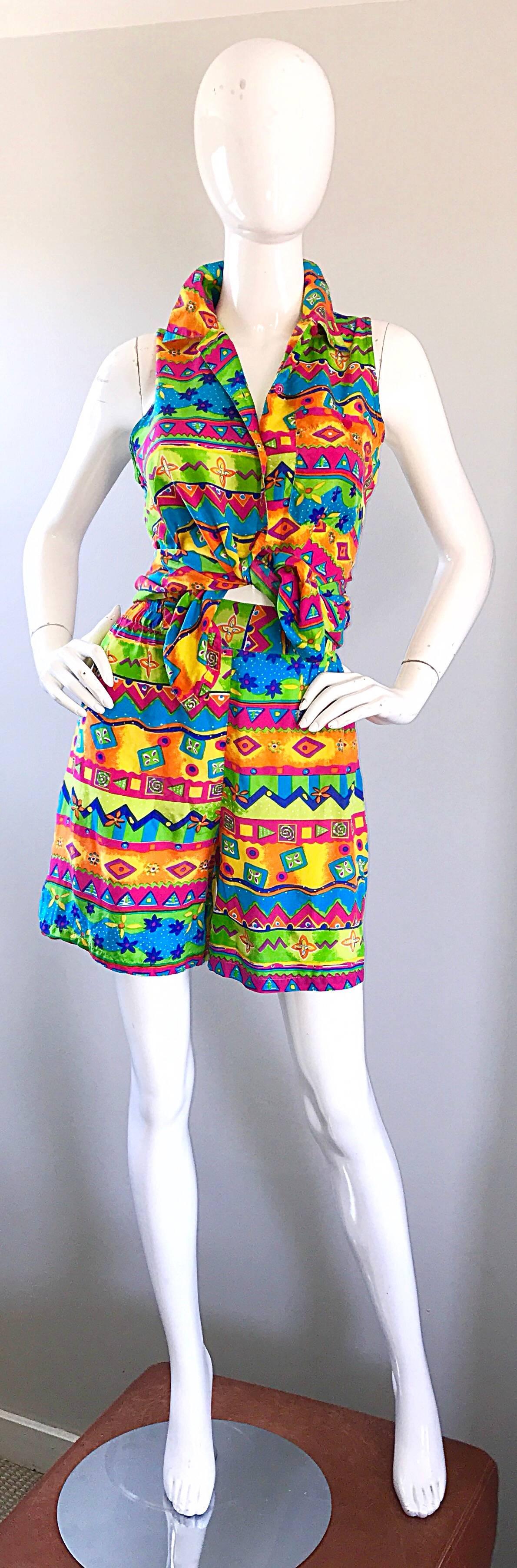 Amazing vintage OSCAR DE LA RENTA brightly colored ethnic print silk top and shorts! Features neon colors in hot pink, blue, yellow, green, and orange throughout. Blouse can either be tied up, or tucked in. Shorts are high waisted, and feature an