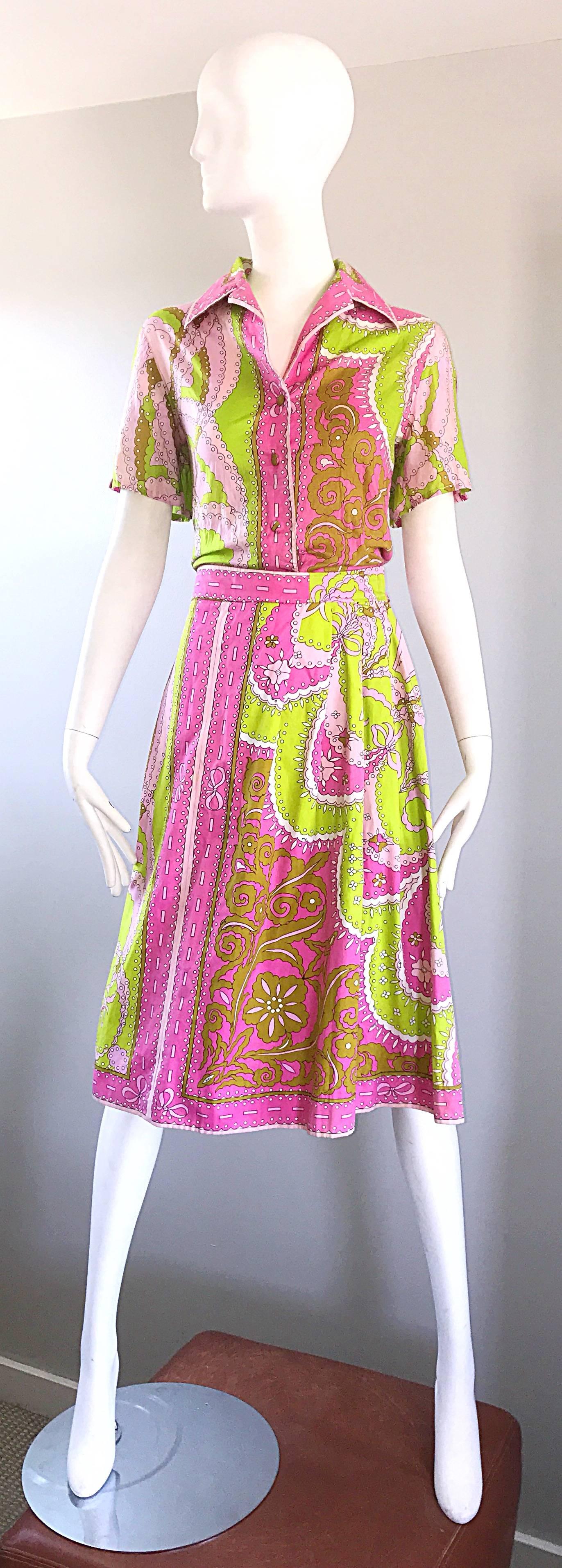 Rare 1960 EMILIO PUCCI lightweight cotton top and A Line skirt ensemble! Features vibrant neon pink, neon green and chartreuse green signature prints throughout. Pucci signature scribbled sporadically thorughout. Blouse buttons up the front in