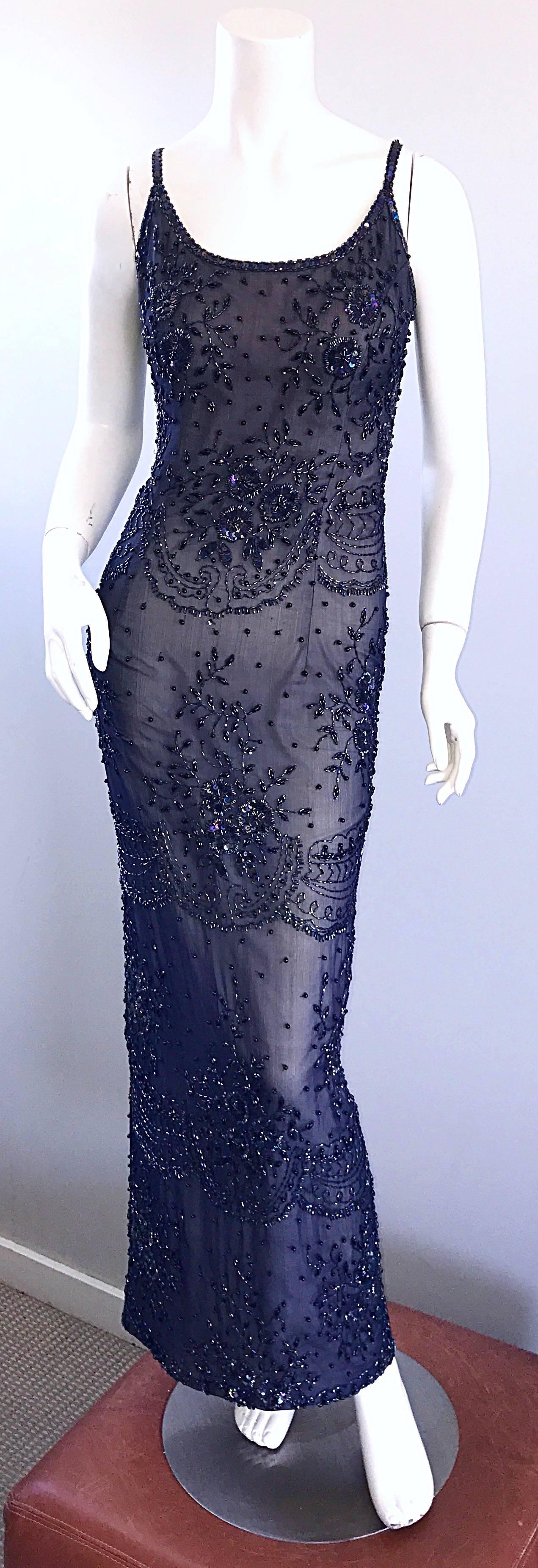 Stunning vintage JUDITH ANN navy blue and grey / nude lining evening gown and lightweight jacket! Both pieces feature iridescent hand-sewn sequins and beads throughout. Dress has a nude gray lining to the knees. The bottom portion of the skirt is