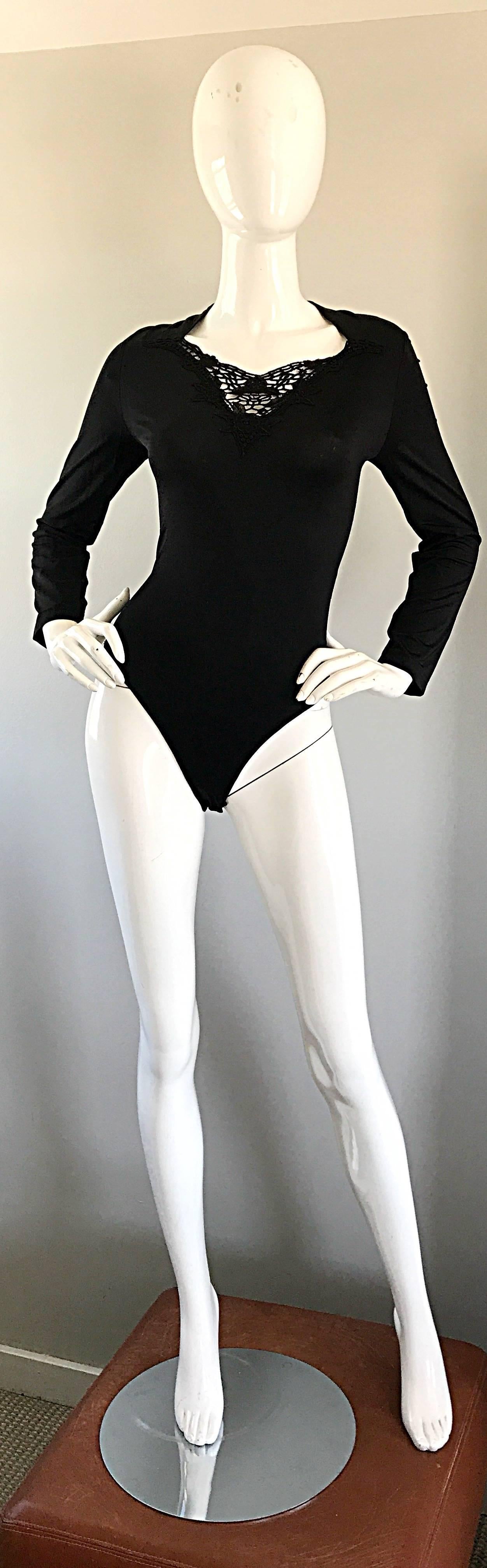Sexy 90s ESCADA by MARGARETHA LEY black long sleeve bodysuit! Features a cut-out crochet design with sequins above the bust that resembles a butterfly. Soft rayon and elastic material stretches to fit (85%Rayon 15% Elastane. Adjustable snaps below